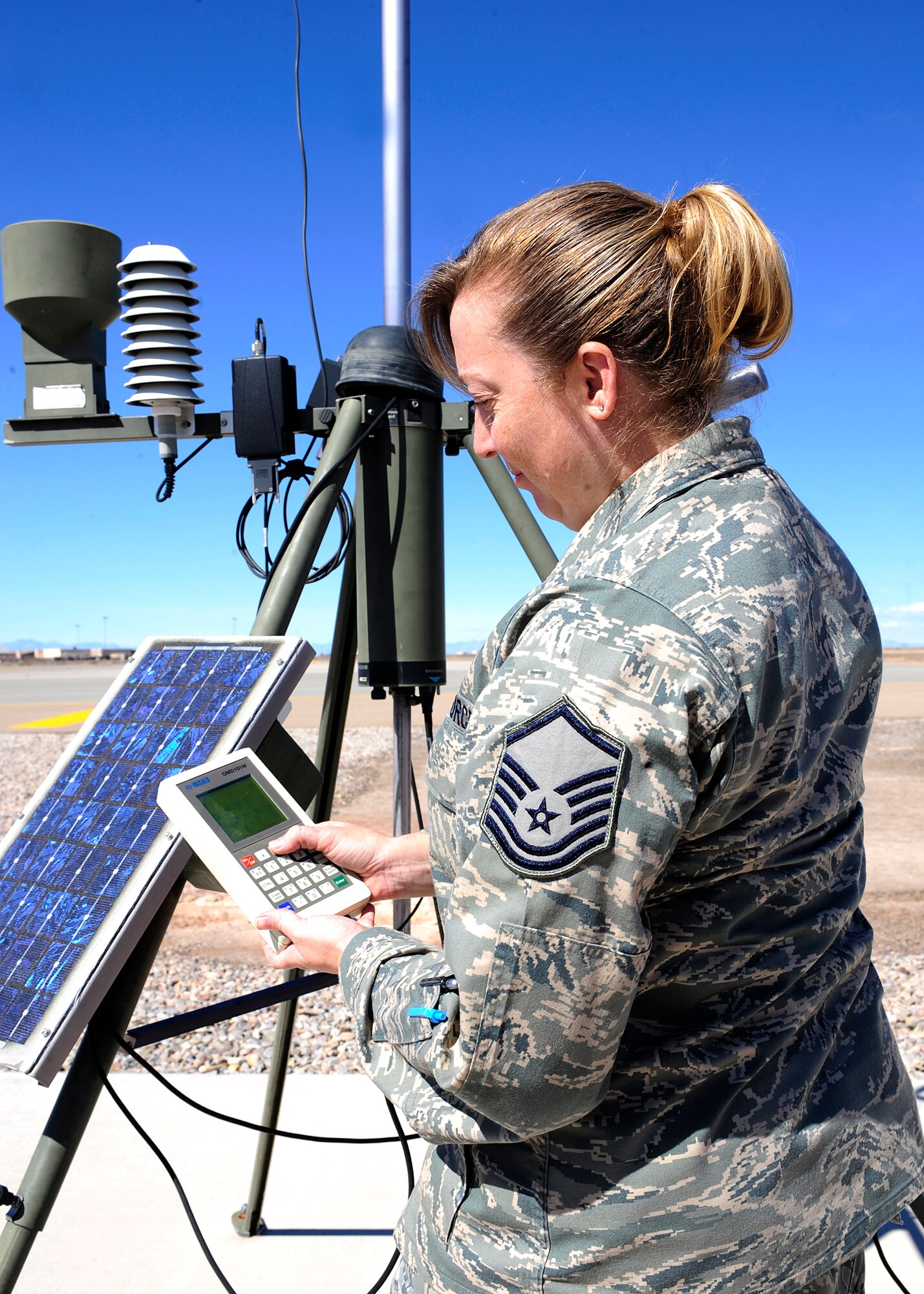 HOLLOMAN AIR FORCE BASE, N.M. -- Master Sgt. Dionne Tirschel, 49th Operations Support Squadron weather flight, studies the display from the tactical weather observing system, Feb. 26, in order to determine the type of clouds in the area. The weather flight specializes in collecting, analyzing and disseminating weather information, including forecasts of weather conditions in the atmosphere and space. The forecast helps Team Holloman put together flight schedules and plan for inclement weather, helping to maintain the safety of Holloman Airman.  (U.S. Air Force photo by Senior Airman DeAndre Curtiss)