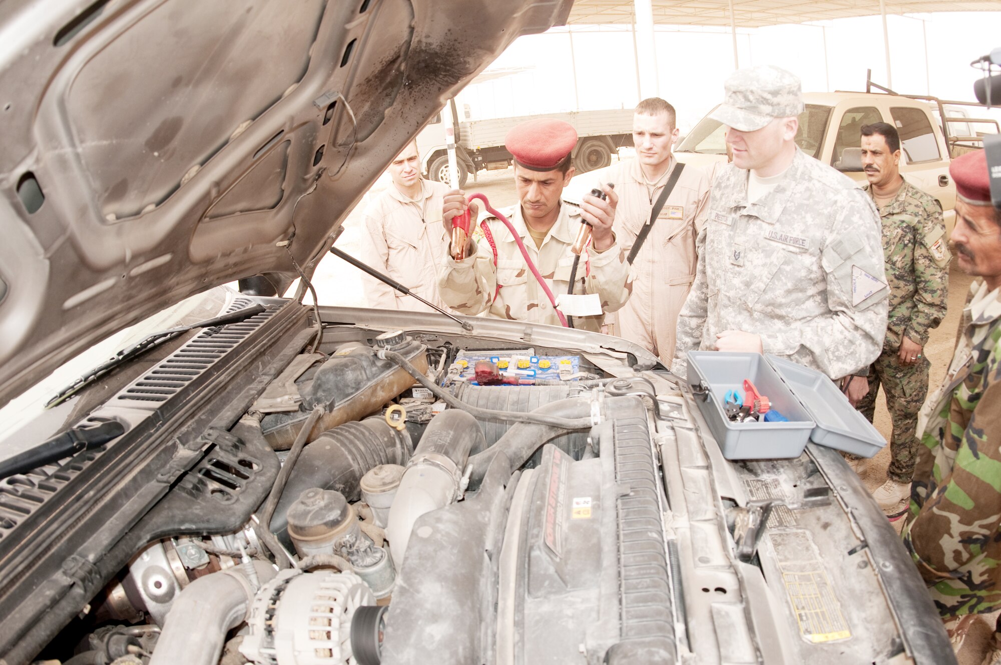 Tech. Sgt. Scott Preston tests Iraqi army students on the sequential placing of jumper cables on a charged battery during a training course Feb. 22, 2010, at Camp Ur, Iraq. Sergeant Preston is assigned to the Logistics Military Advisory Team. (U.S. Air Force photo/Senior Master Sgt. Elizabeth Gilbert)