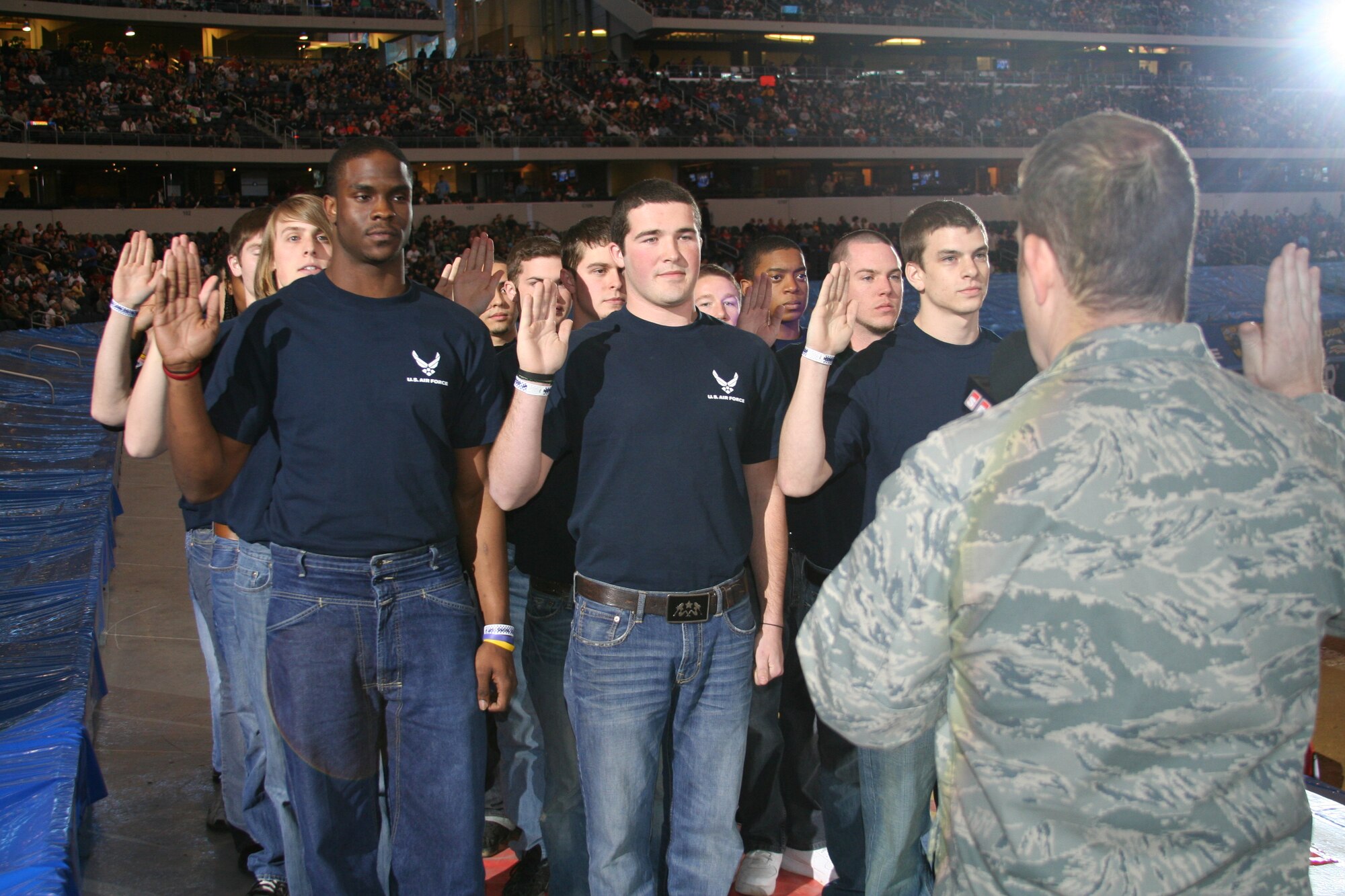 Members of the 344th Delayed Entry Program are sworn in by Lt. Col. Sean McKenna at Monster Jam in Arlington, Texas, February 27, 2010.  (U.S. Air Force photo/Technical Sgt. Dustin Beard)