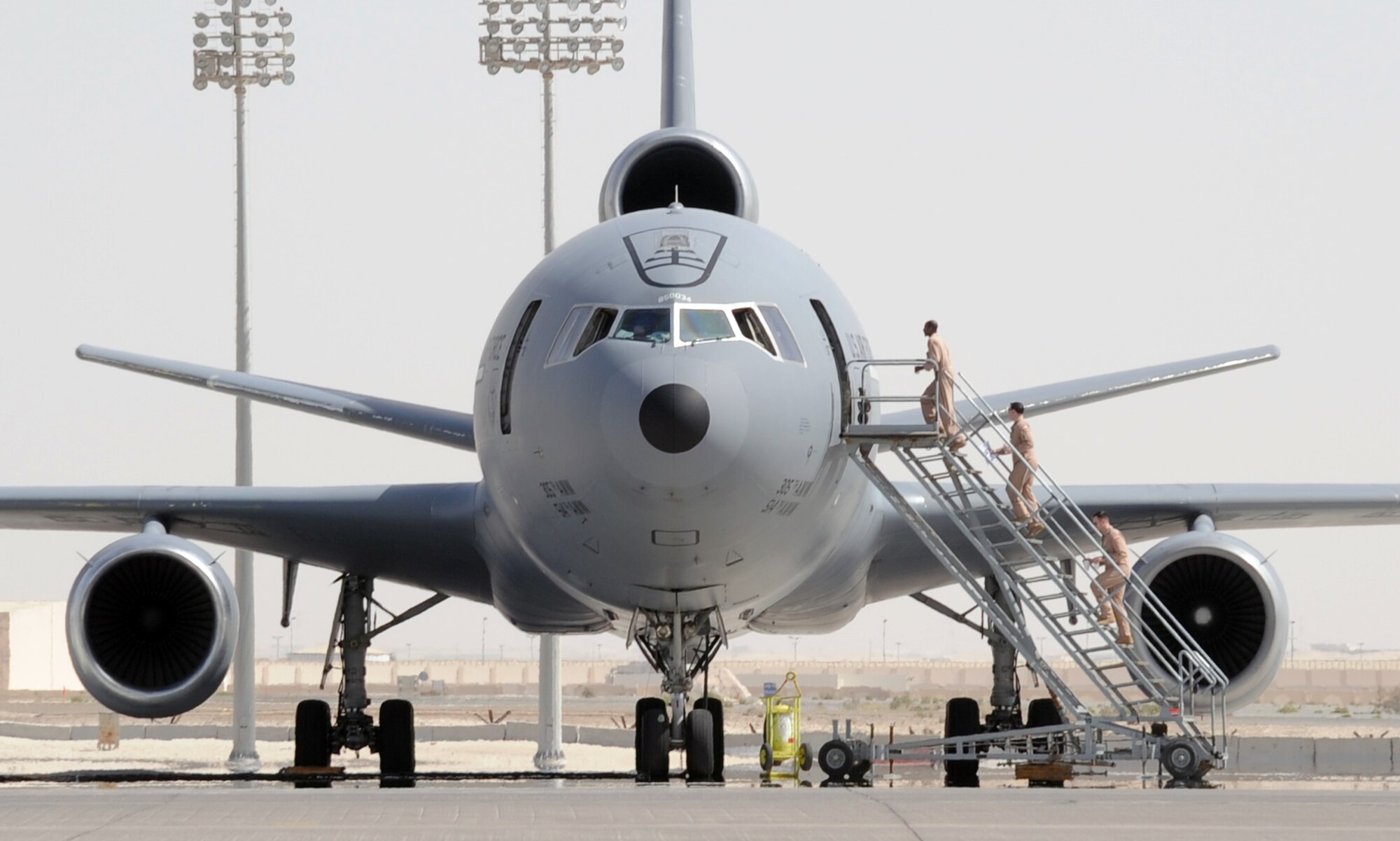 A flight crew climbs aboard a KC-10 Extender assigned to the 908th Expeditionary Air Refueling Squadron of the 380th Air Expeditionary Wing prior to a mission during flightline operations at a non-disclosed base in Southwest Asia. In 2009, KC-10s from the 380th AEW and the 908th EARS flew 4,760 combat sorties offl-loading 422,222,300 pounds of fuel to 31,434 aircraft. In the same year, the KC-10s and their crews accumulated 40,011 hours of flight time. The 380th AEW and its units support operations Iraqi Freedom and Enduring Freedom and the Combined Joint Task Force-Horn of Africa. (U.S. Air Force Photo/Master Sgt. Scott T. Sturkol/Released)