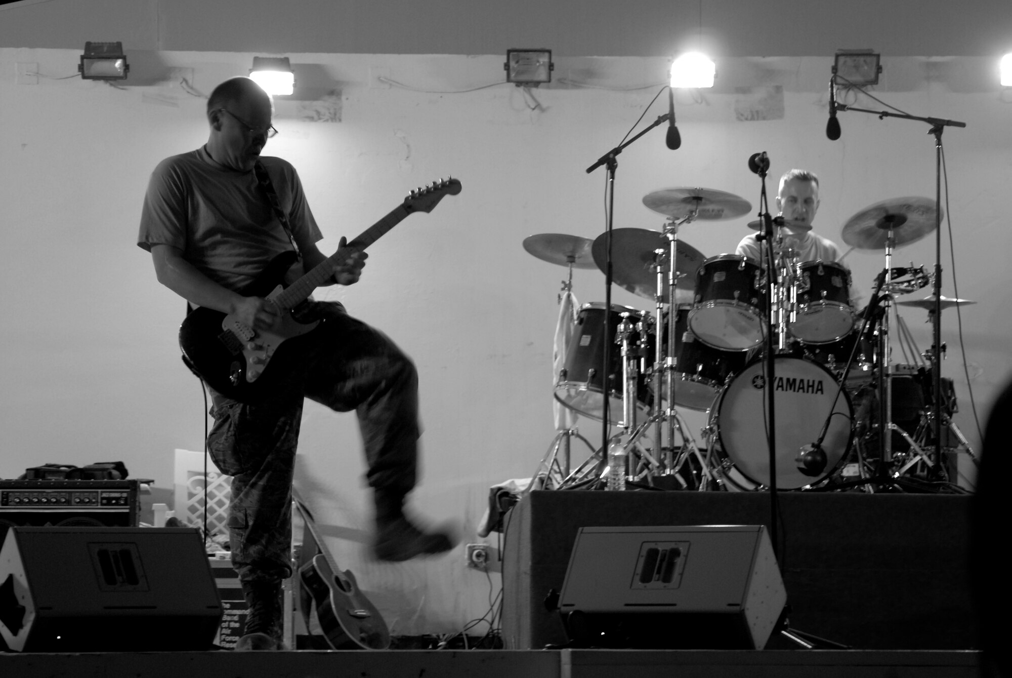 Senior Airman Josh Byrd, Reserve Generation guitarist, and Tech. Sgt. David Vittetoe, play their second expeditionary gig Feb. 27 in Southwest Asia. The current U.S. Air Forces Central Command Expeditionary Band is a five-member group, which plays a wide range of genres, from R-and-B to alternative rock. (U.S. Air Force photo/Senior Airman Dillon White/released)