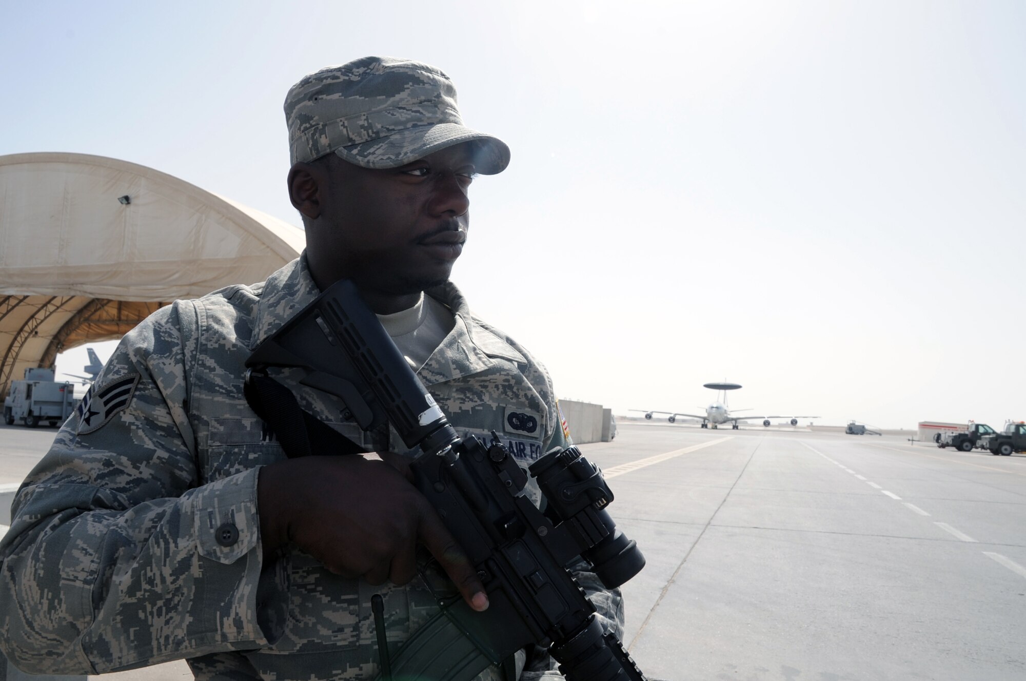 Senior Airman William White, a security forces journeyman with the 380th Expeditionary Security Forces Squadron, watches over a checkpoint during operations near the flightline for the 380th Air Expeditionary Wing at a non-disclosed base in Southwest Asia on Feb. 23, 2010. Airman White is deployed from the 386th Security Forces Squadron at Dover Air Force Base, Del., and his hometown is Bridgeport, Conn. The 380th ESFS, as part of the 380th AEW, supports operations Iraqi Freedom and Enduring Freedom and the Combined Joint Task Force-Horn of Africa. (U.S. Air Force Photo/Master Sgt. Scott T. Sturkol)