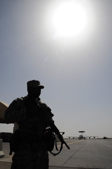 Senior Airman William White, a security forces journeyman with the 380th Expeditionary Security Forces Squadron, watches over a checkpoint during operations near the flightline for the 380th Air Expeditionary Wing at a non-disclosed base in Southwest Asia on Feb. 23, 2010. Airman White is deployed from the 386th Security Forces Squadron at Dover Air Force Base, Del., and his hometown is Bridgeport, Conn. The 380th ESFS, as part of the 380th AEW, supports operations Iraqi Freedom and Enduring Freedom and the Combined Joint Task Force-Horn of Africa. (U.S. Air Force Photo/Master Sgt. Scott T. Sturkol)