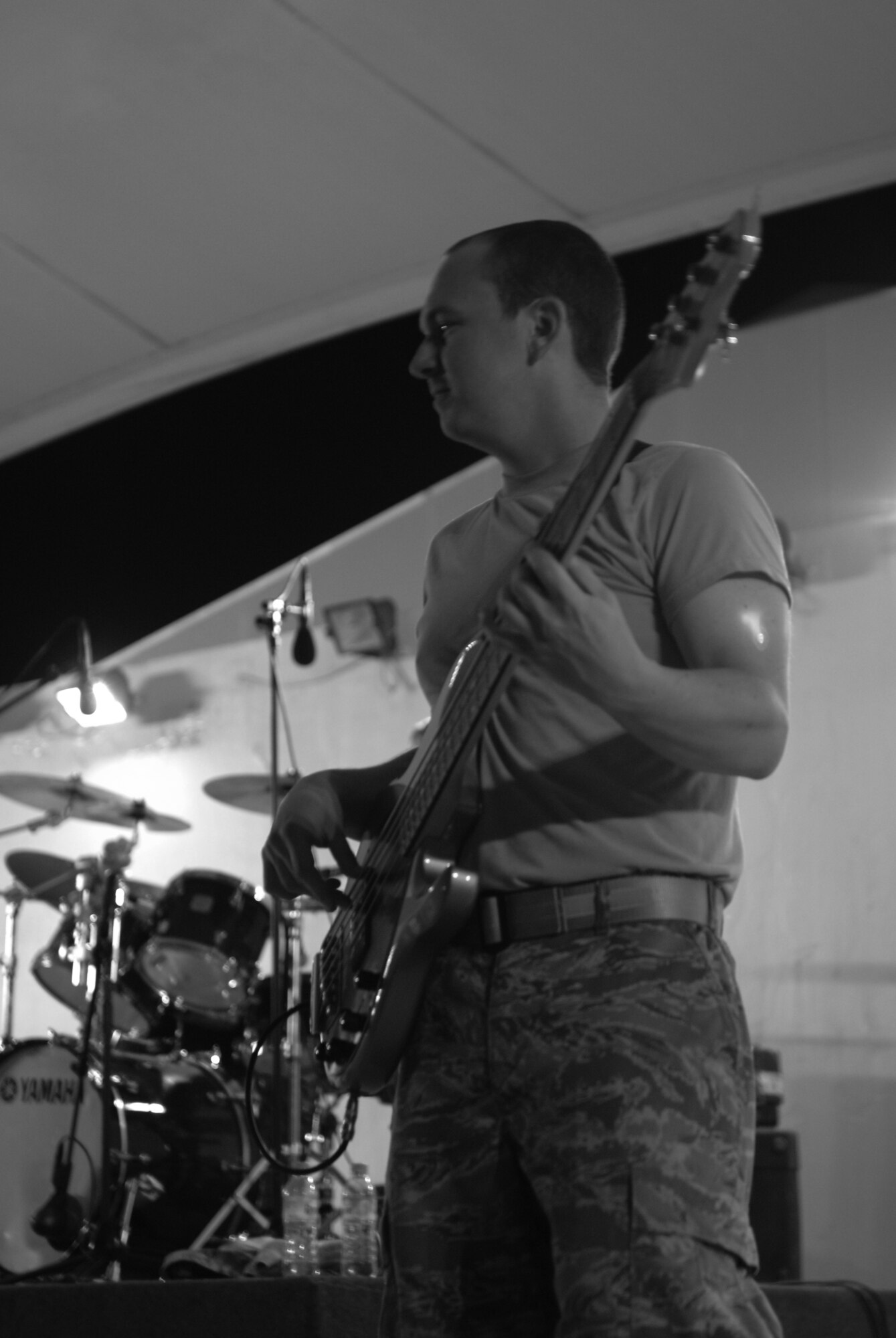 Airman 1st Class Darren King, Reserve Generation bassist, performs for an audience of U.S and Coalition servicemembers in Southwest Asia Feb. 27. Airman King will tour the AOR for the next 60 days as part of the five-person, U.S. Air Forces Central Command Expeditionary Band. (U.S. Air Force photo/Senior Airman Dillon White/released)