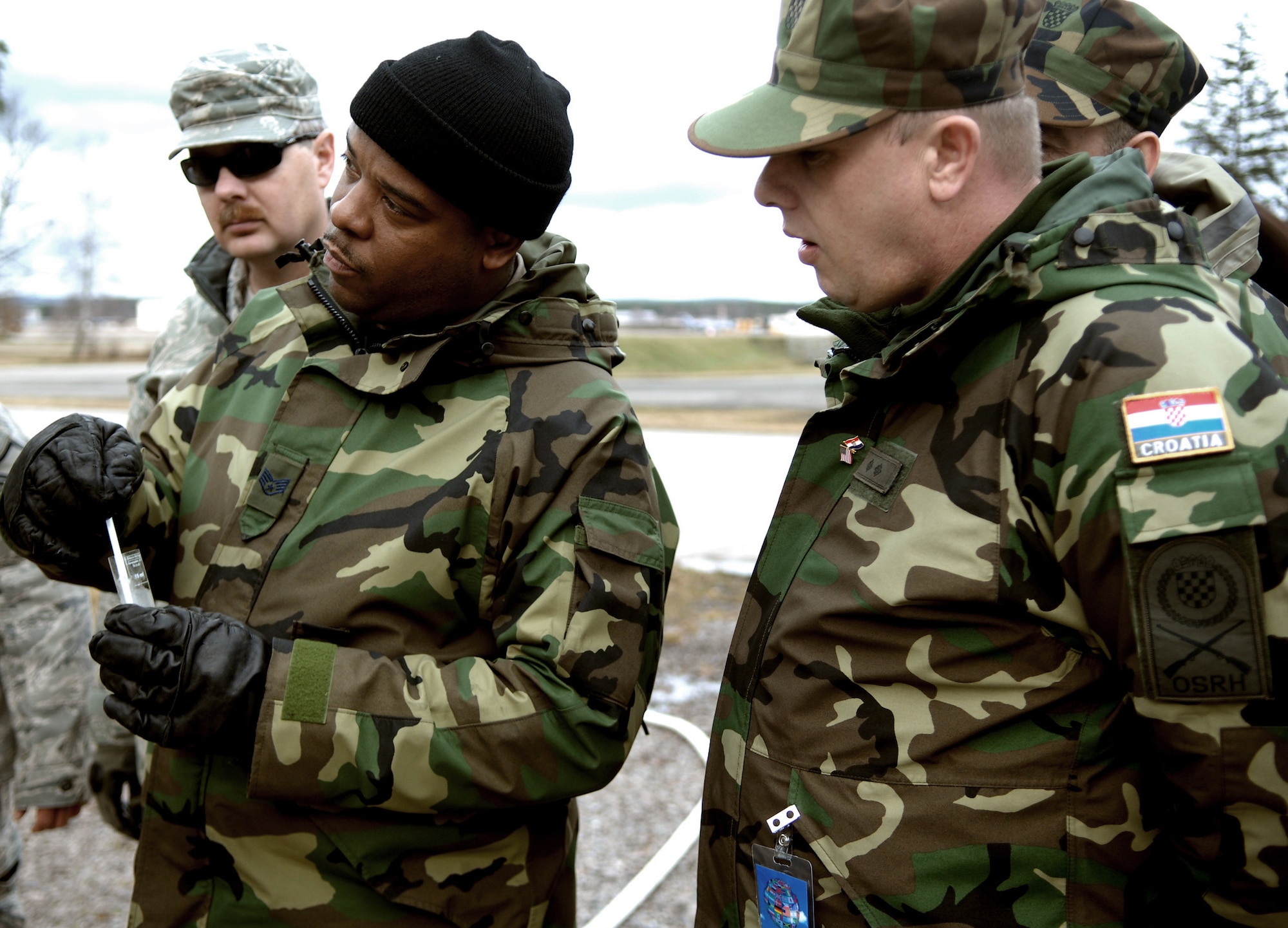 U.S. Air Force Reserve Staff Sgt. Maurice Wakins and Private 1st Class Stanko Bosnjak test water they have just purified using the H9518-1 reverse osmosis water purification unit. This year’s Silver Flag Exercise hosted here Feb. 21 - 28 allowed USAFE Airmen, Air Force Reserve and members of the Croatian Army for the first time to observe how Airmen prepare to deploy to austere locations. (U.S. Air Force photo by Tech. Sgt. Michael Voss)
