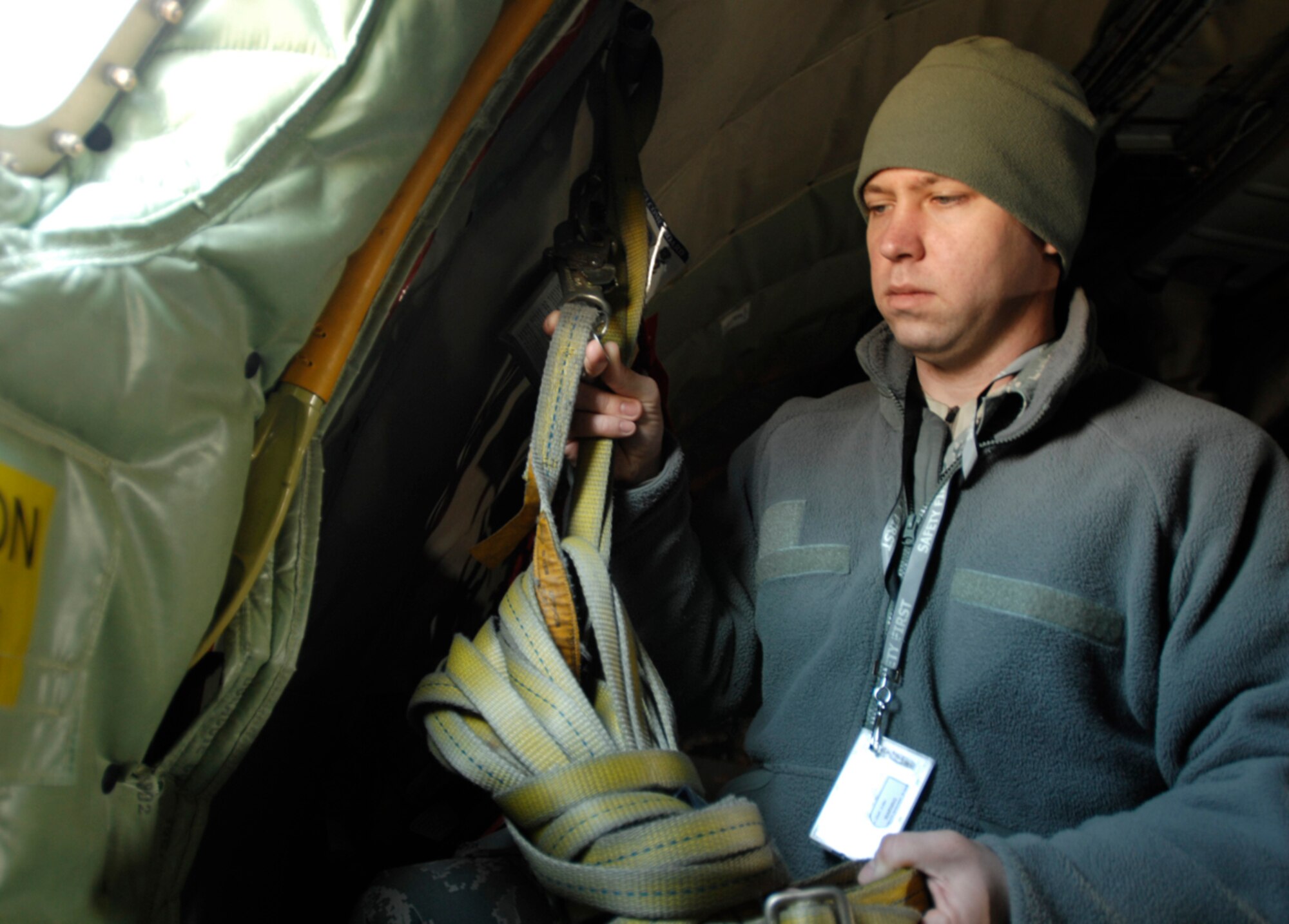 Staff Sgt. William Holmes, 22nd Air Refueling Wing ground safety supervisor, inspects a fall protection harness on a KC-135 Stratotanker, Feb. 26, 2010, at McConnell Air Force Base, Kan. The Hope Mills, N.C., native also manages and conducts safety programs, conducts mishap investigations, inspects and surveys work areas, offering risk management consultations and safety education. (U.S. Air Force photo/ Senior Airman Jessica Lockoski)  