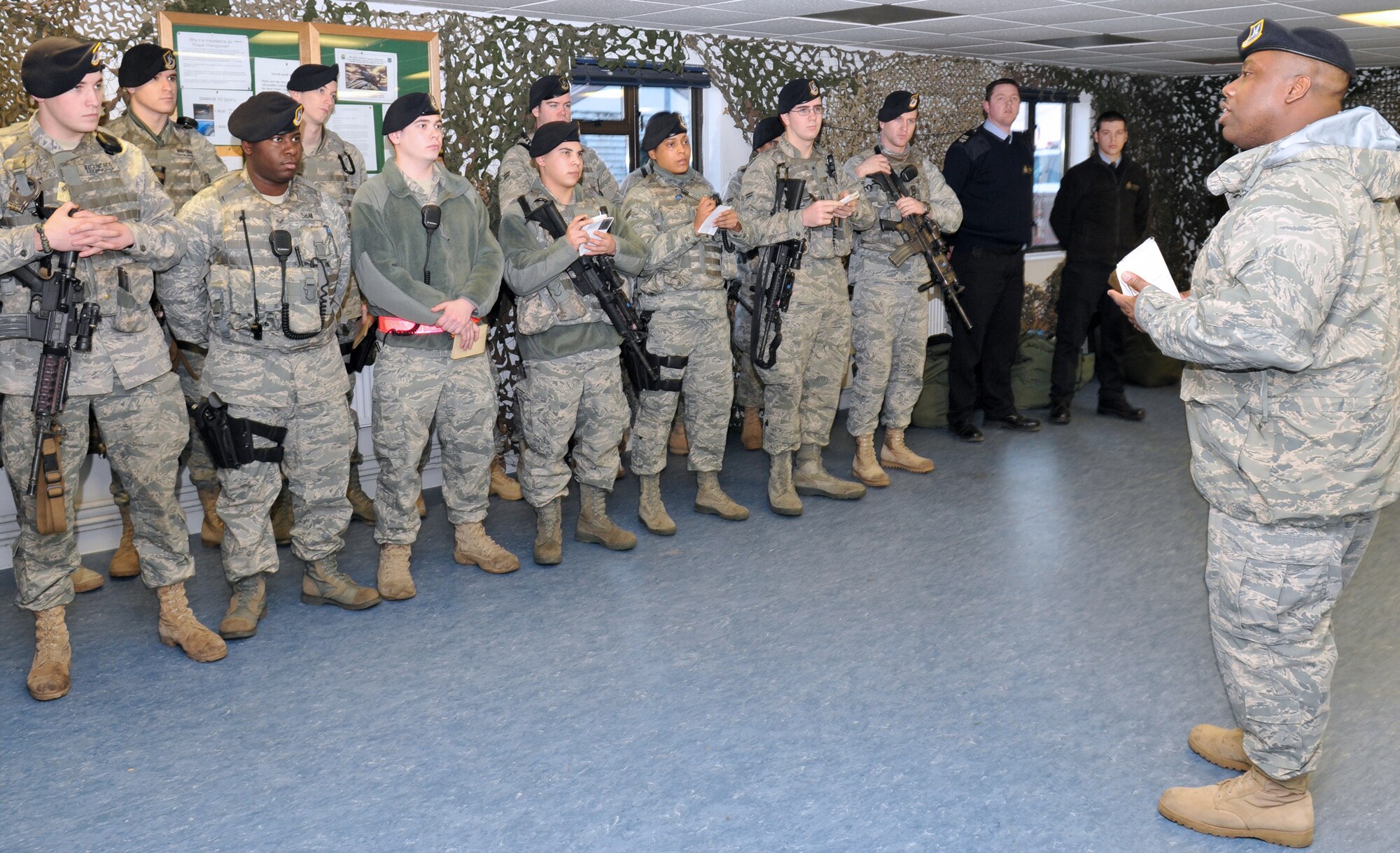 Master Sgt. Emmett Tibbs, 100th Security Forces Squadron Operations superintendent, briefs Delta Flight on what he expects of them during their 12-hour night shift March 1. While deployed to Iraq, Sergeant Tibbs led a 78-person flight to perform a law-and-order mission for about 30,000 servicemembers. (U.S. Air Force photo by Tech. Sgt. Kevin Wallace)