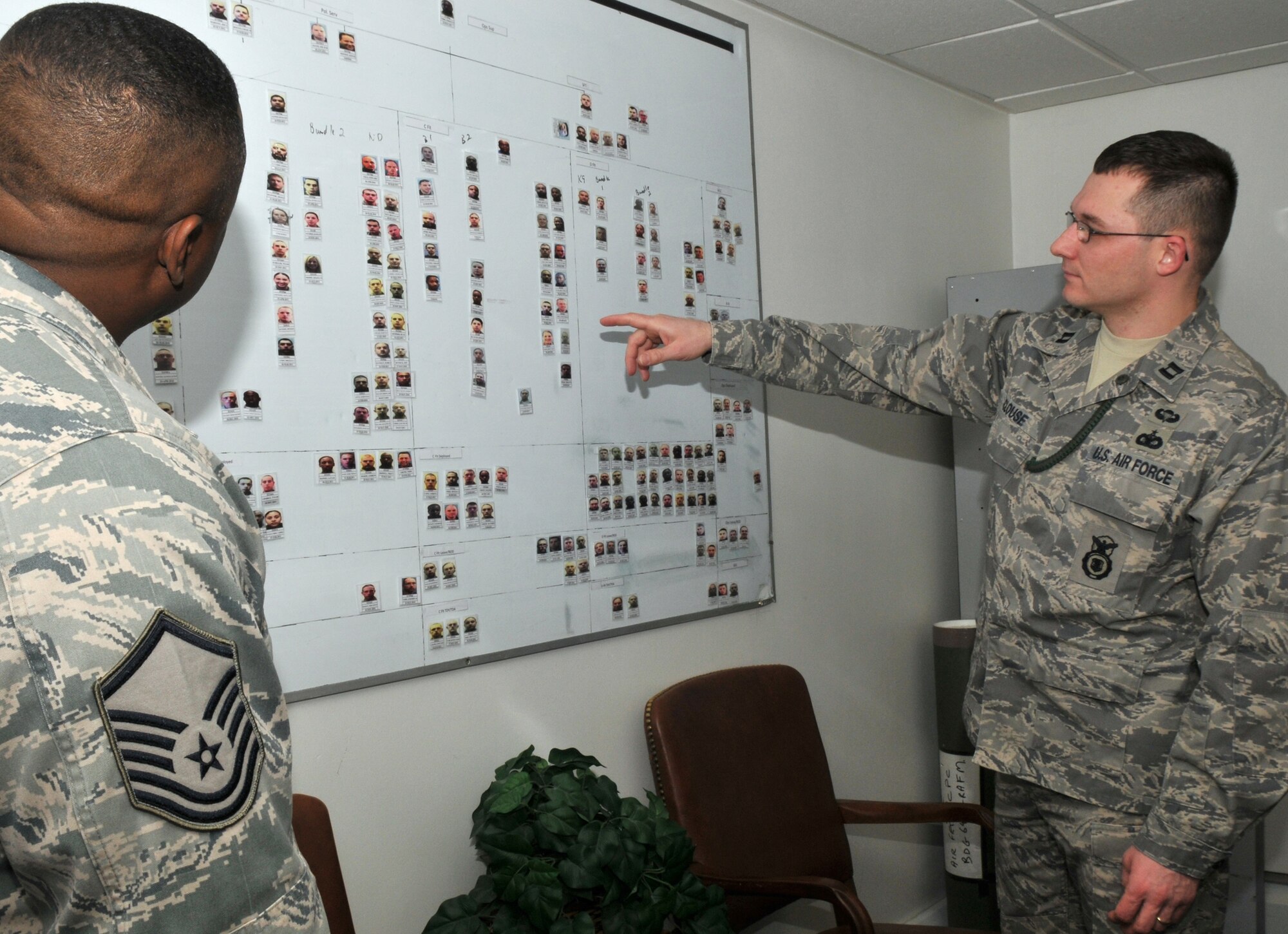Capt. Robert Clouse, 100th Security Forces Squadron Operations officer, discusses changes to their flight?s organization with his superintendent, Master Sgt. Emmett Tibbs, March 1. Captain Clouse said the master sergeant is doing what Defenders do best ? keeping their base safe. (U.S. Air Force photo by Tech. Sgt. Kevin Wallace)