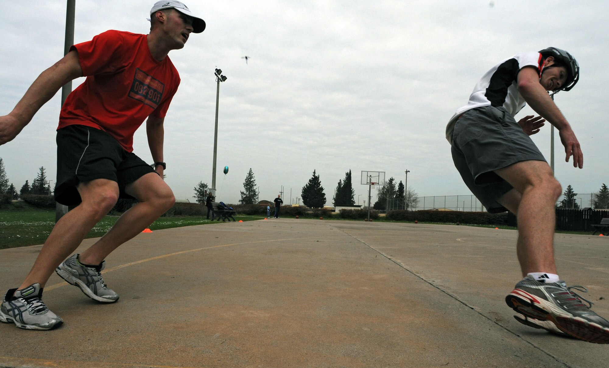 Members of the winning team, Staff Sgt. Bradley Williams, 39th Maintenance Squadron and Seth Jenny, 39th Medical Operations Squadron, perform suicide runs as a part of the basketball challenge during Incirlik’s Amazing Race Saturday, Feb. 27, 2010 at Incirlik Air Base, Turkey. The race consisted of 17 teams biking to 12 designated locations to either complete a challenge or pay $5 to move to the next location. The challenges consisted of different activities including completing a stretcher obstacle course with the 39th Medical Group, solving a riddle at the base library and many more that tested the teams’ physical and mental abilities. (U.S. Air Force photo/Senior Airman Sara Csurilla)
