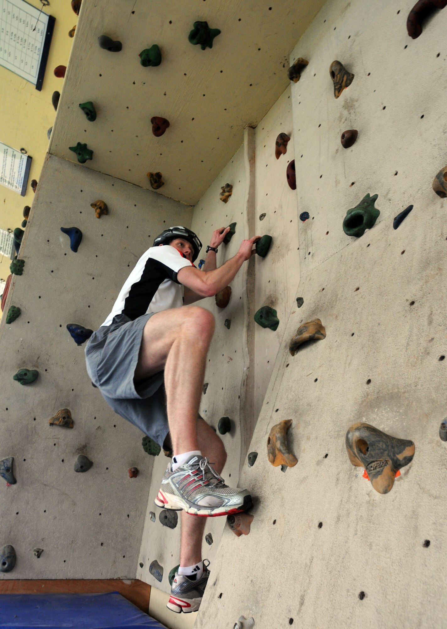Seth Jenny, 39th Medical Operations Squadron and a part of the Amazing Race winning team, tests his climbing ability on a rock climbing wall at Arkadas Park Saturday, Feb. 27, 2010 at Incirlik Air Base, Turkey. The race consisted of 17 teams biking to 12 designated locations to either complete a challenge or pay $5 to move to the next location. The challenges consisted of different activities including completing a stretcher obstacle course with the 39th Medical Group, solving a riddle at the base library and many more that tested the teams’ physical and mental abilities. (U.S. Air Force photo/Senior Airman Sara Csurilla)