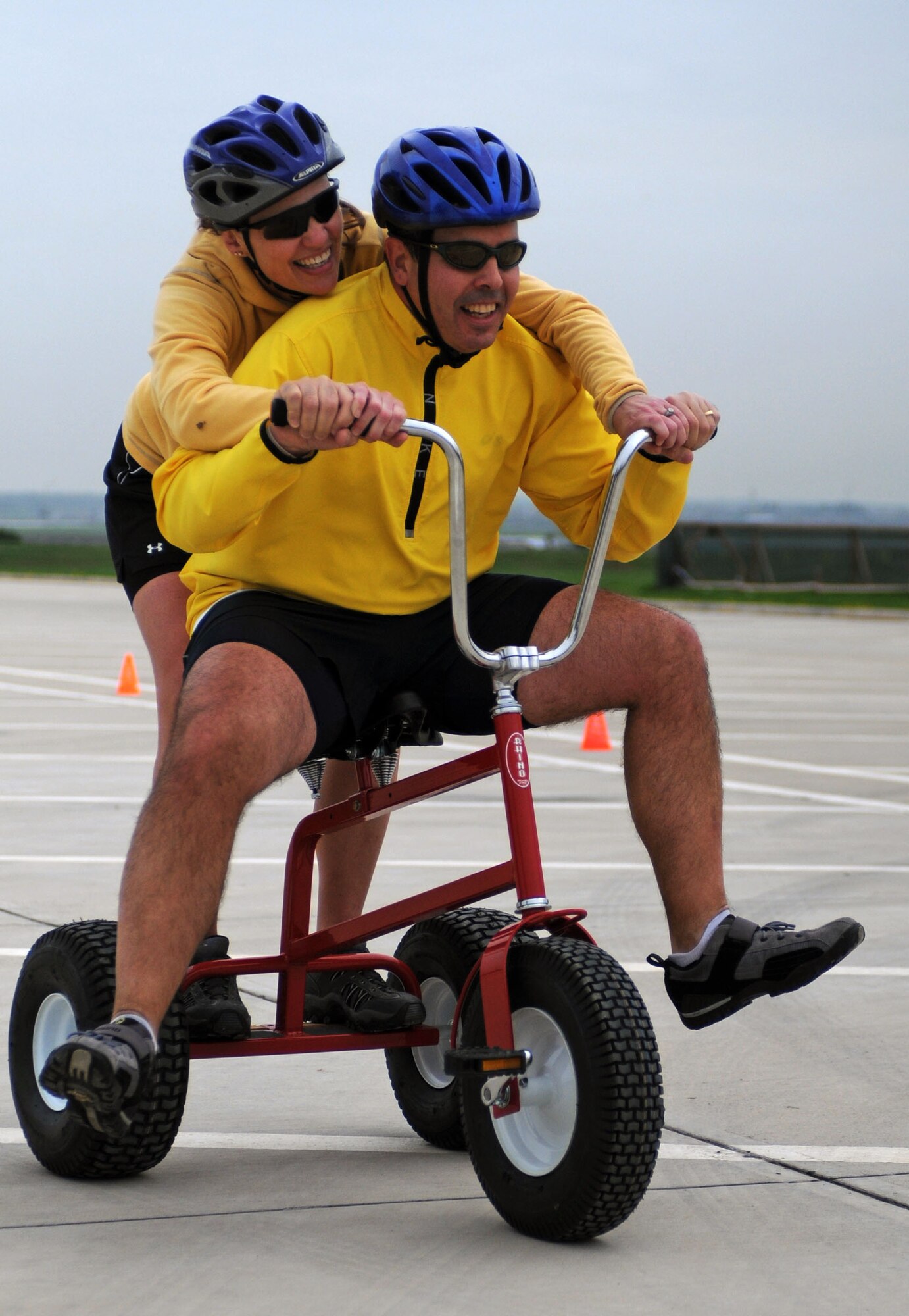 Anthony Ventura, AAFES manager and his wife Kim, fly across the finish line of the tricycle obstacle course during Incirlik’s Amazing Race Saturday, Feb. 27, 2010 at Incirlik Air Base, Turkey. The race consisted of 17 teams biking to 12 designated locations to either complete a challenge or pay $5 to move to the next location. The challenges consisted of different activities including completing a stretcher obstacle course with the 39th Medical Group, solving a riddle at the base library and many more that tested the teams’ physical and mental abilities. (U.S. Air Force photo/Senior Airman Sara Csurilla)