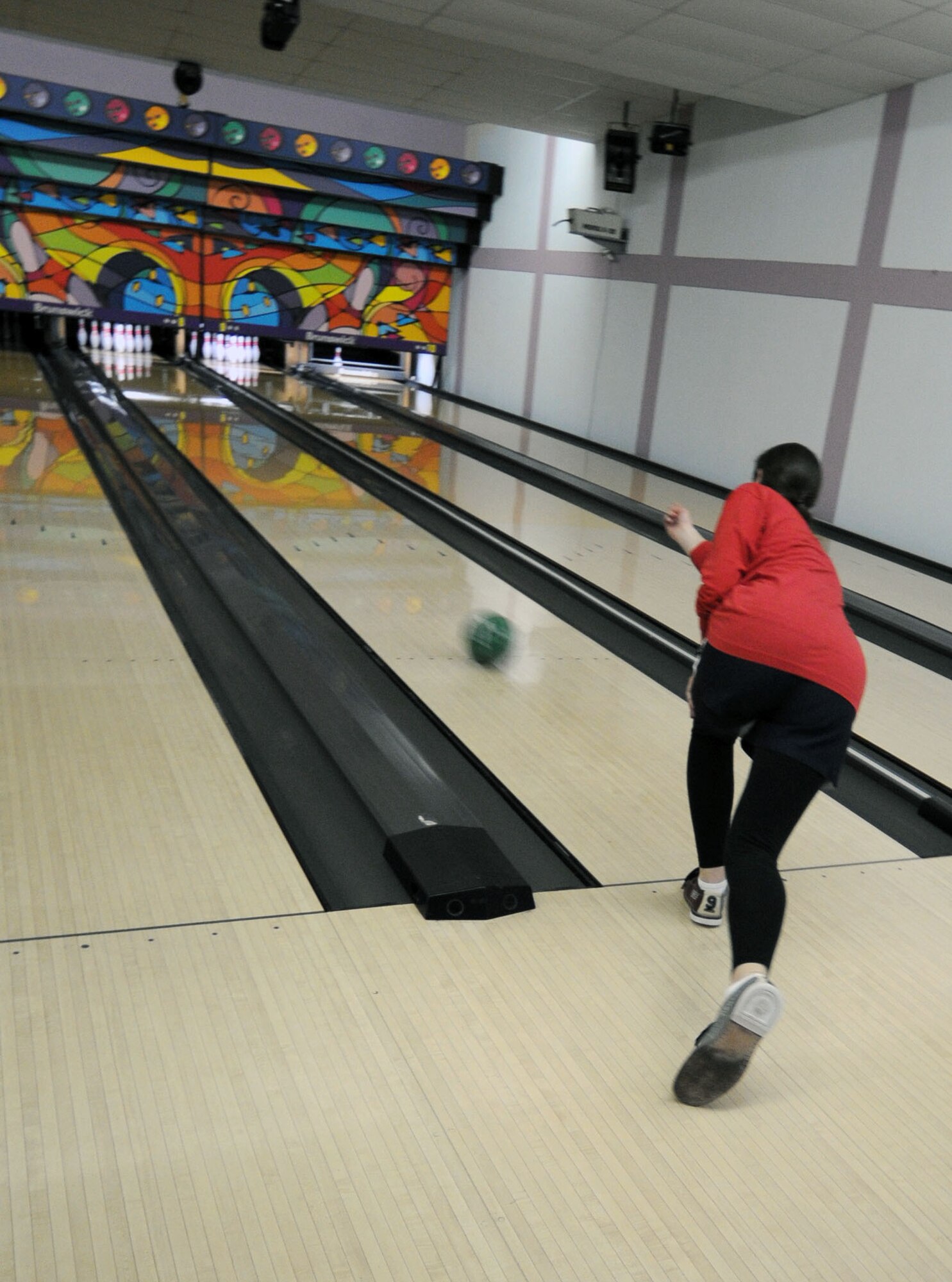 A participant in the Incirlik’s Amazing Race attempts to bowl for a strike Saturday, Feb. 27, 2010 at Incirlik Air Base, Turkey. The race consisted of 17 teams biking to 12 designated locations to either complete a challenge or pay $5 to move to the next location. The challenges consisted of different activities including completing a stretcher obstacle course with the 39th Medical Group, solving a riddle at the base library and many more that tested the teams’ physical and mental abilities. (U.S. Air Force photo/Senior Airman Sara Csurilla)