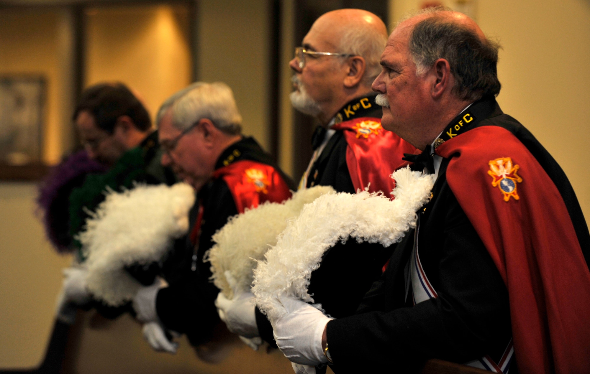 BUCKLEY AIR FORCE BASE, Colo. -- Members of the Knights of Columbus pray during a sacrament of confirmation service at the Buckley Chapel Feb. 23. The Knights of Columbus are a Catholic service group. (U.S. Air Force photo by Airman 1st Class Paul Labbe)