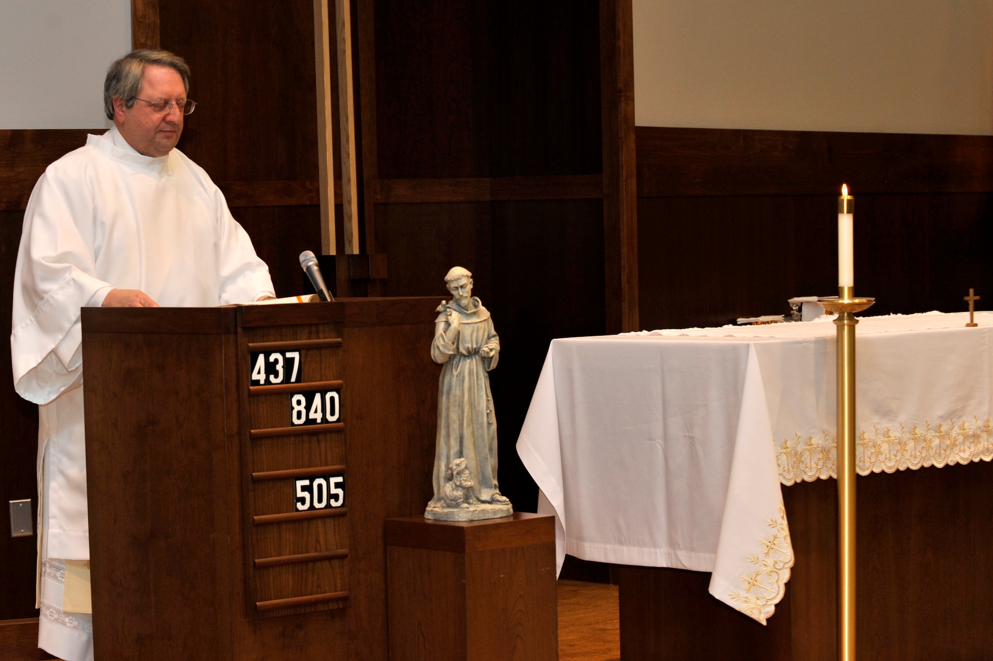 BUCKLEY AIR FORCE BASE, Colo. -- Deacon Richard Borda, Buckley Chapel Roman Catholic coordinator, assists with the sacrament of confirmation service Feb. 23. (U.S. Air Force photo by Airman 1st Class Paul Labbe)