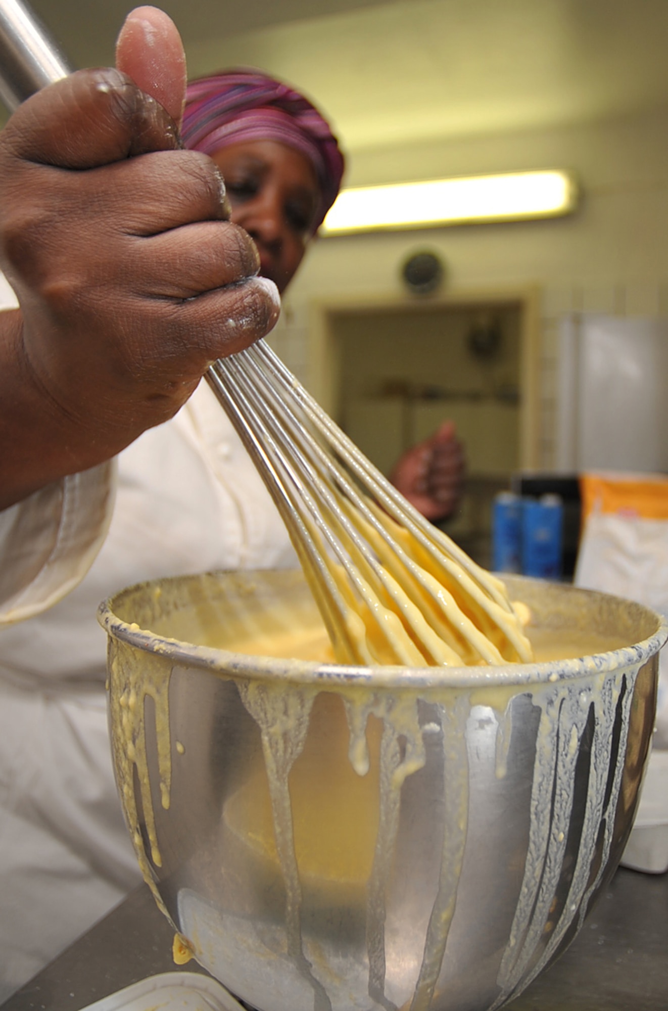 Brenda 'Mama' West, professional chef, mixes a cornbread batter in the kitchen of her restaurant, Ramstein village, Germany, Feb. 25, 2010. Mama West has been volunteering her time and cooking skills to feed U.S. servicemembers and wounded warriors in the KMC for over a decade. (U.S. Air Force photo by Senior Airman Tony R. Ritter) 
