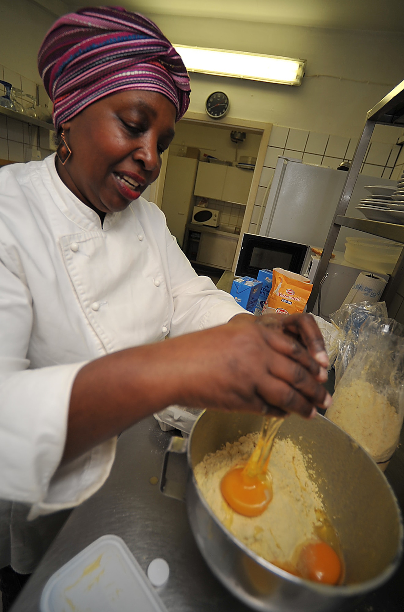 Brenda 'Mama' West, professional chef, mixes a cornbread batter in the kitchen of her restaurant, Ramstein village, Germany, Feb. 25, 2010. Mama West has been volunteering her time and cooking skills to feed U.S. servicemembers and wounded warriors in the KMC for over a decade. (U.S. Air Force photo by Senior Airman Tony R. Ritter) 