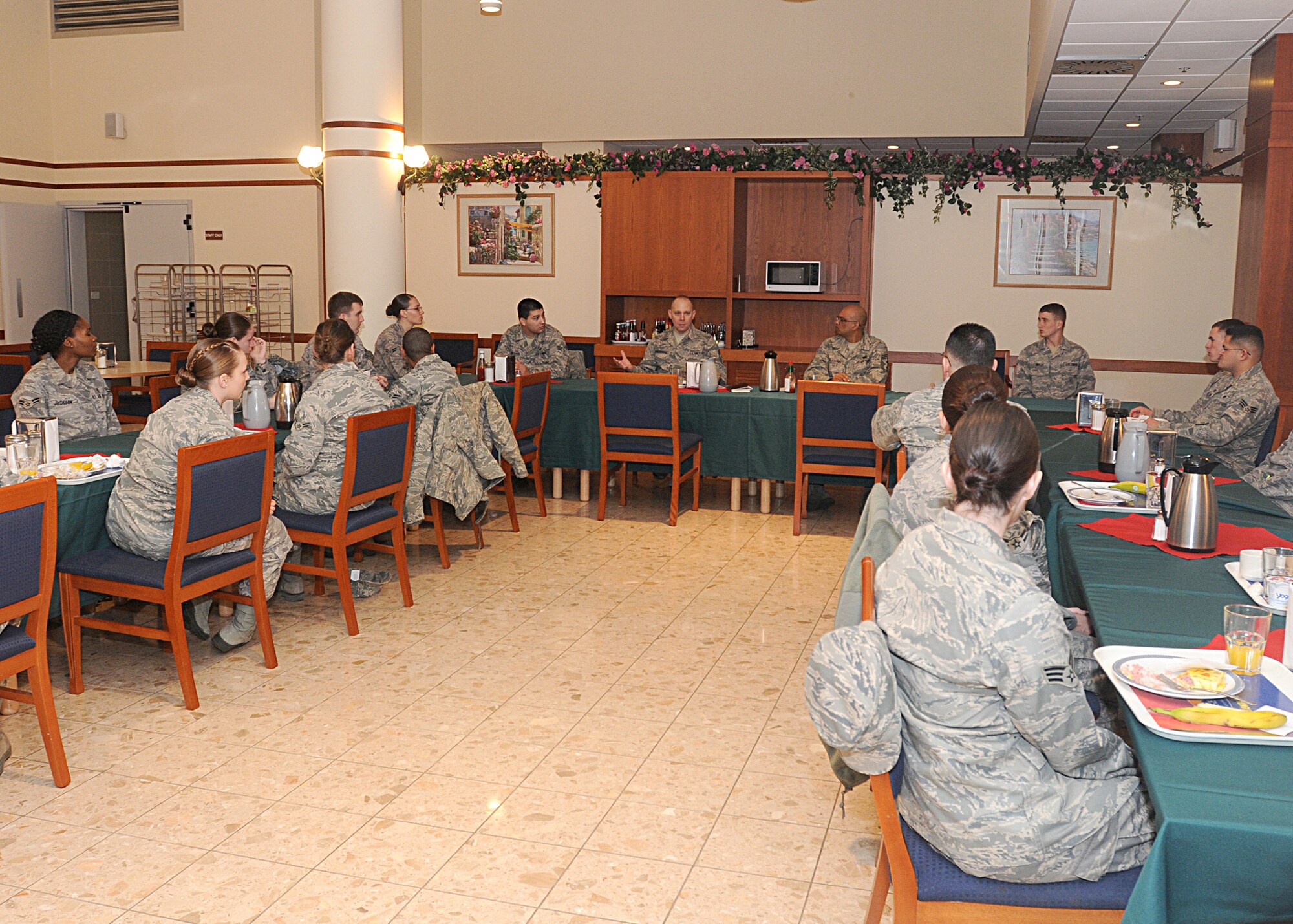 Chief Master Sgt. Dennis Vannorsdall, 3rd Air Force command chief, eats breakfast with Aviano Airmen Feb. 26, 2010, at the La Dolce Vita Dining Facility in Area F.  Chief Vannorsdall answered questions and discussed important topics with Airmen to include the new physical training program and the Year of the Air Force Family.  (U.S. Air Force photo/Senior Airman Tabitha M. Mans)