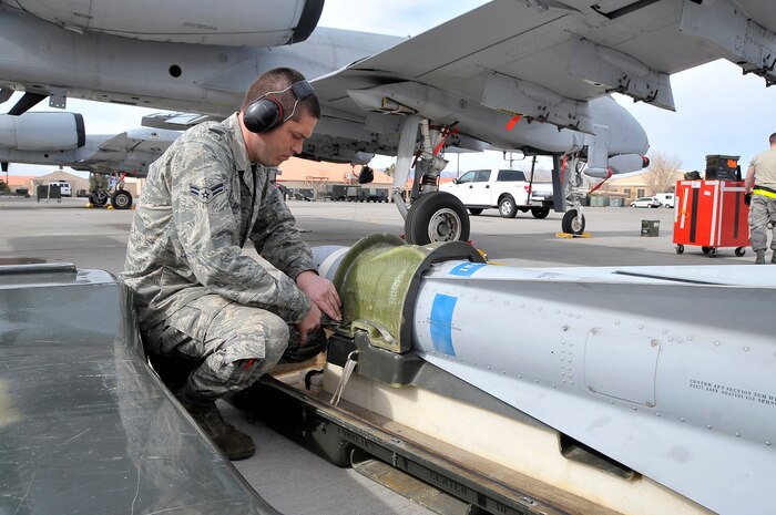 NELLIS AIR FORCE BASE, Nev. -- Airman 1st Class John Davis, 52nd Aircraft Maintenance Squadron, Spangdahlem Air Base, Germany,  prepares a Mavrick missile to be loaded aboard an A-10 Warthog during Red Flag 10-3 Feb. 26. Airman Davis hails from Memphis, Tenn., and is participating in his first exercise of this kind. (U.S. Air Force photo by Tech. Sgt. Chris Flahive)
