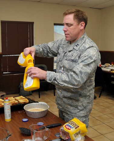 NELLIS AIR FORCE BASE, Nev. -- Chaplain (Capt.) Robert "Father Bob" Monagle prepares pancakes for flight line maintainers Feb. 25 during Red Flag 10-3. Chaplain Monagle is deployed from Holloman AFB, N.M., and is here to monitor morale and lend a friendly ear to anyone who needs to talk. (U.S. Air Force photo by Tech. Sgt. Chris Flahive)