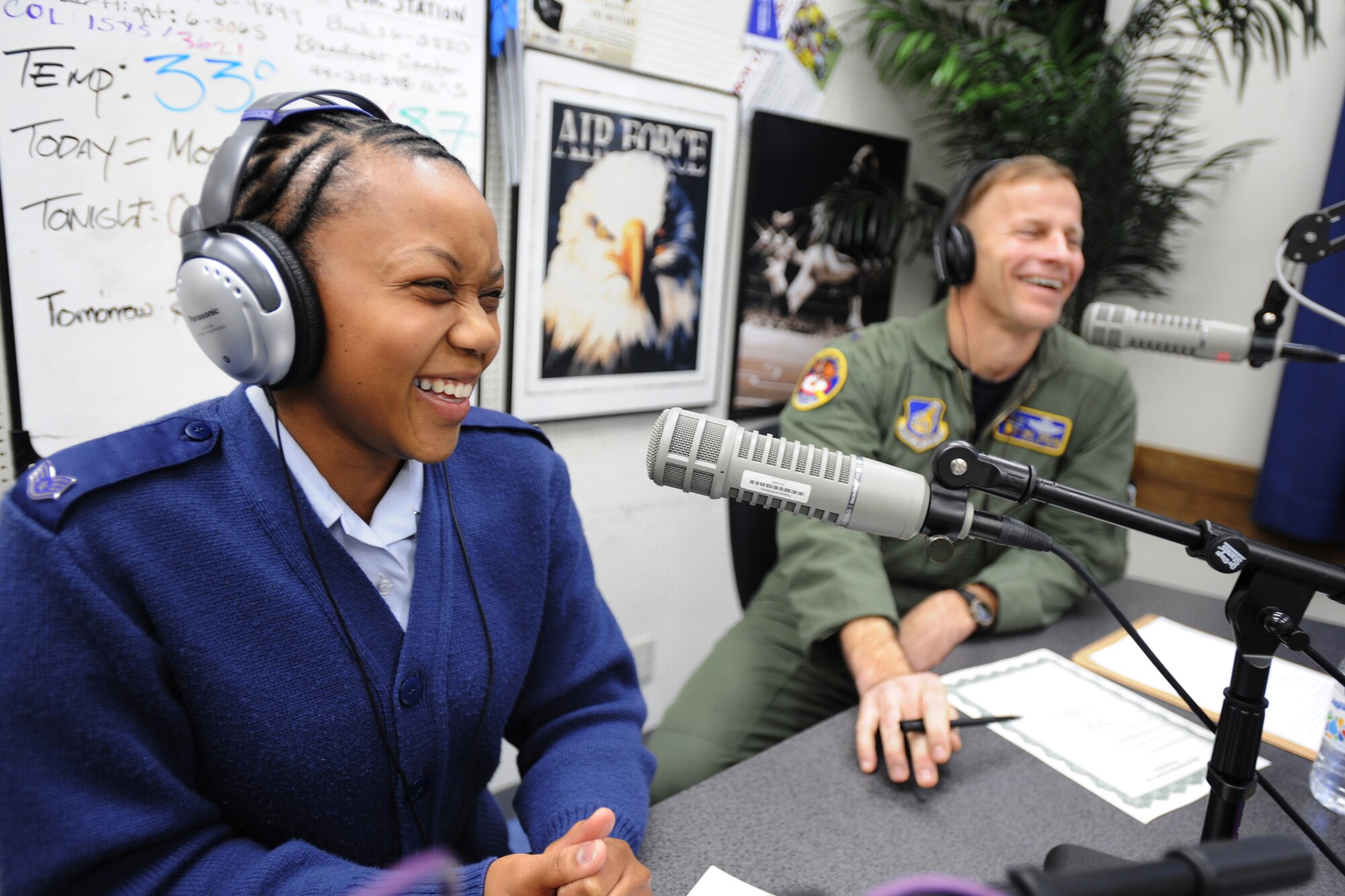 MISAWA AIR BASE, Japan -- Staff Sgt. Vanessa Arthur, 35th Aerospace Medicine Squadron health promotions NCO in charge, and Col. RC Craig, 35th Fighter Wing vice commander, share laughs during an American Forces Network radio broadcast March 1. Sergeant Arthur and Colonel Craig spoke about healthy food choices and signed a proclamation to begin National Nutrition Month at Misawa. Throughout the month, the Health and Wellness Center will host a series of events to promote the importance of making healthy food choices. (U.S. Air Force photo/Senior Airman Jamal D. Sutter)