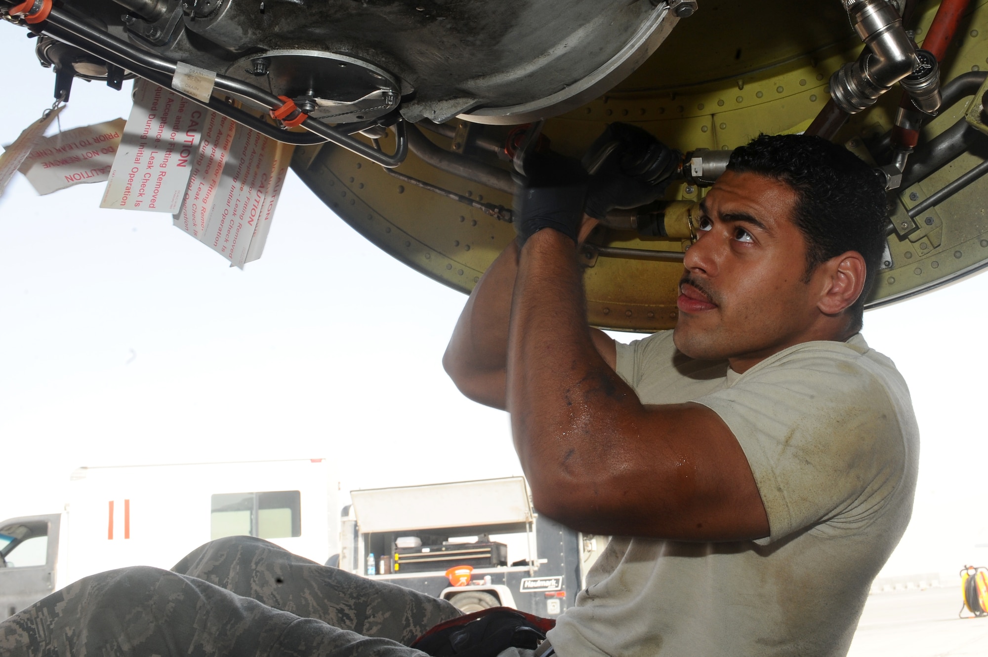 Senior Airman Ramon Rivera, 340th Aircraft Maintenance Unit environmental electrical technician, works on a KC-135 Stratotanker generator transfer at a non-disclosed Southwest Asia location Feb. 25, 2010. (U.S. Air Force photo by Senior Airman Kasey Zickmund)[RELEASED]