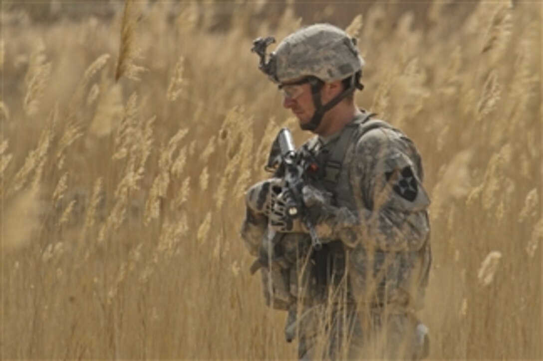 U.S. Army Sgt. Jeremy Nevil, with Alpha Company, 1st Battalion, 17th Infantry Regiment, conducts a dismounted combat patrol in Badula Qulp, Helmand province, Afghanistan, during Operation Helmand Spider on Feb. 11, 2010.  