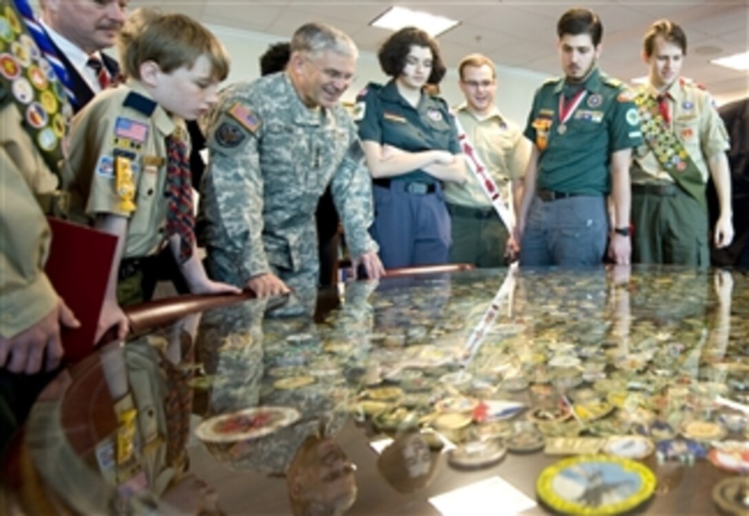Chief of Staff of the Army Gen. George W. Casey Jr. shows his coin collection to members of the Boy Scouts of America in his office in the Pentagon on March 1, 2010.  The Boy Scouts are in Washington to give their Annual Report to the Nation.  
