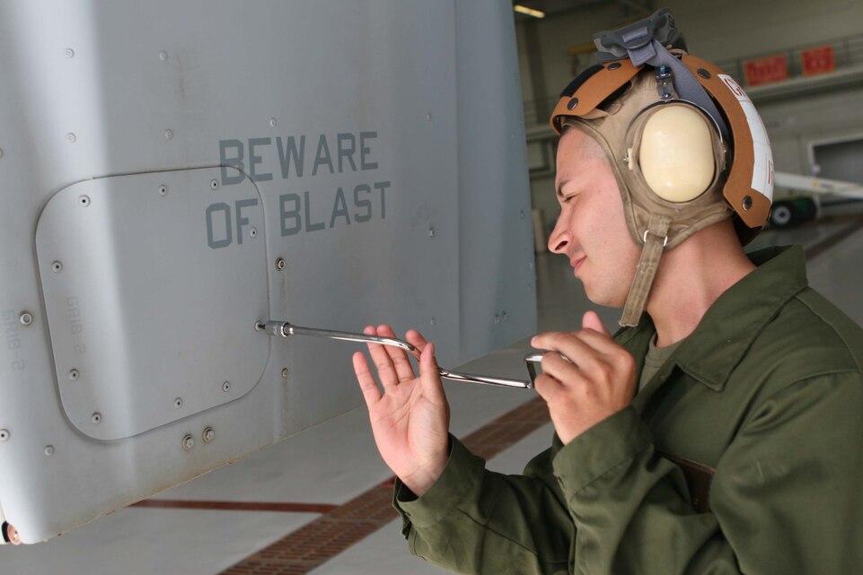 Lance Cpl. Franklin A. Ruiz, a mechanic with Marine Medium Tiltrotor Squadron 161, Marine Aircraft Group 16, 3rd Marine Aircraft Wing, I Marine Expeditionary Unit, secures the exhaust access panel on an MV-22 “Osprey” here March 2. The squadron received its third Osprey Jan. 11 as it replaces a fleet of aging CH-46E “Sea Knight” helicopters.