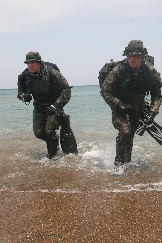 Marines with Force Reconnaissance Company, II MEF exit the water during an amphibious physical training exercise at Curacao March 3, 2010.  The company is doing amphibious reconnaissance training in Curacao and is being aided by the Royal Netherlands Marine Corps, who will be participating in bilateral training with the company.
