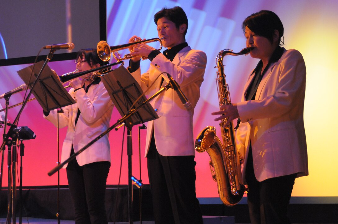 Final Approach performed with local Japanese high school students in a joint concert consisting of four choirs, horn players from Fussa wind ensemble, and the Tokyo Metropolitan Fussa high school rock band.  The theme was “Melody Line Connecting Hearts”.   Each group performed individually and everyone came together to perform the final selection “We Are the World”.  This event was a great way to enhance the relations and partnership that Yokota AB, and Fussa City/ local neighboring cities have shared over the past 50 years.  NCOIC of Final Approach MSgt Packard had this to say about the event, “This was a great opportunity to interact with our local neighbors, and share the importance of Yokota’s mission to the Japanese people.”