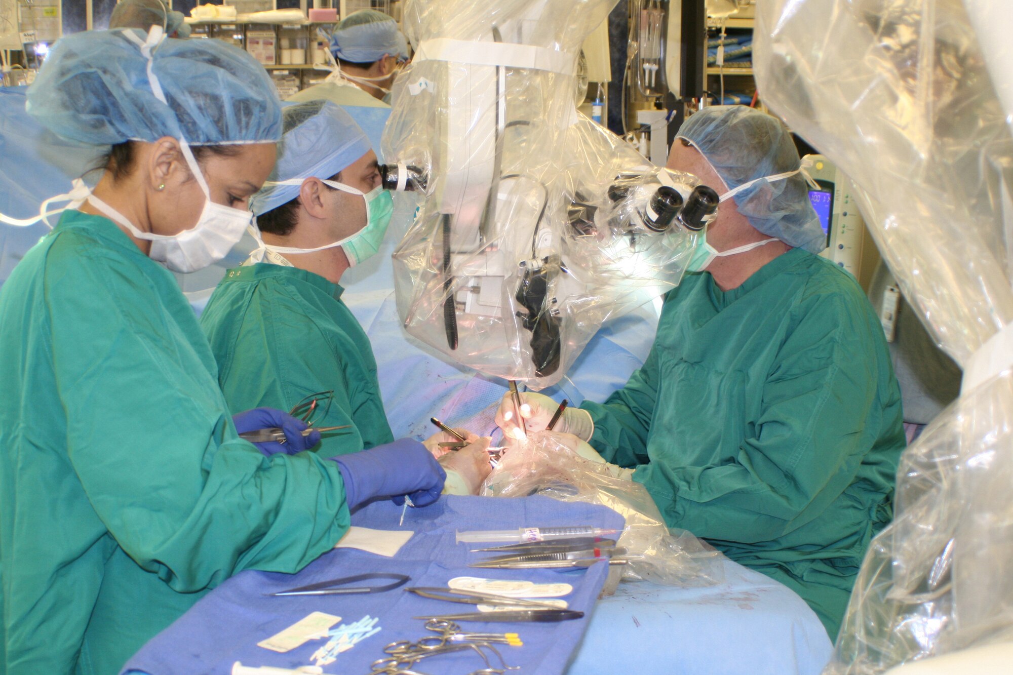 A surgical team composed of military and civilian doctors perform the first-ever female hand transplant Feb. 17, 2010, at Wilford Hall Medical Center, Texas. Retired Master Sgt. Janet McWilliams is the 10th person to undergo this procedure and the first to have it done in a Defense Department facility. (Courtesy photo)
