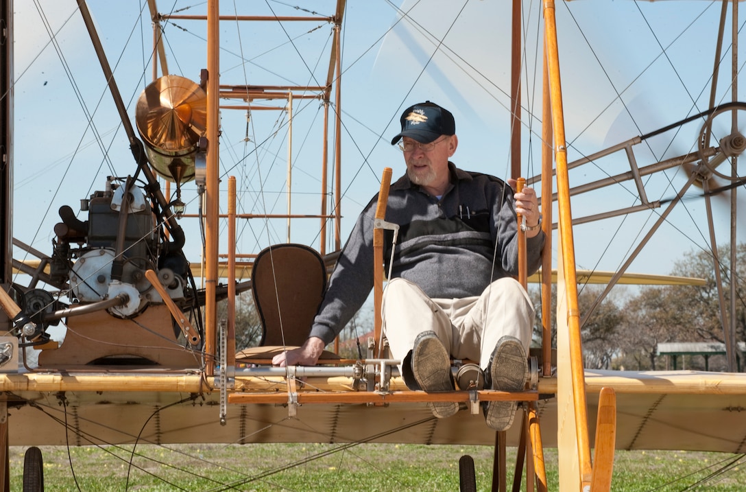 With the Ford Model A engine warmed up and propellers were spinning behind him, Don Gum was ready to taxi the Wright "B" Flyer "Yellow Bird" on the parade grounds at Fort Sam Houston, Texas, Feb. 27, 2010.  Volunteers from the Wright "B" Flyer Inc. assembled two Flyers in San Antonio for the Centennial of Military Aviation event held March 2. (U.S. Air Force photo/Lance Cheung)
