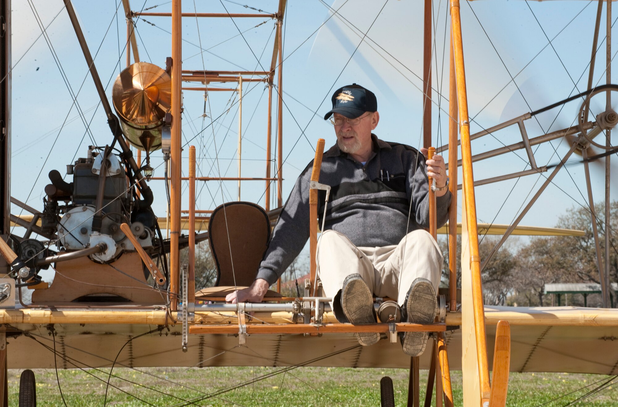 With the Ford Model A engine warmed up and propellers were spinning behind him, Don Gum was ready to taxi the Wright "B" Flyer "Yellow Bird" on the parade grounds at Fort Sam Houston, Texas, Feb. 27, 2010.  Volunteers from the Wright "B" Flyer Inc. assembled two Flyers in San Antonio for the Centennial of Military Aviation event held March 2. (U.S. Air Force photo/Lance Cheung)