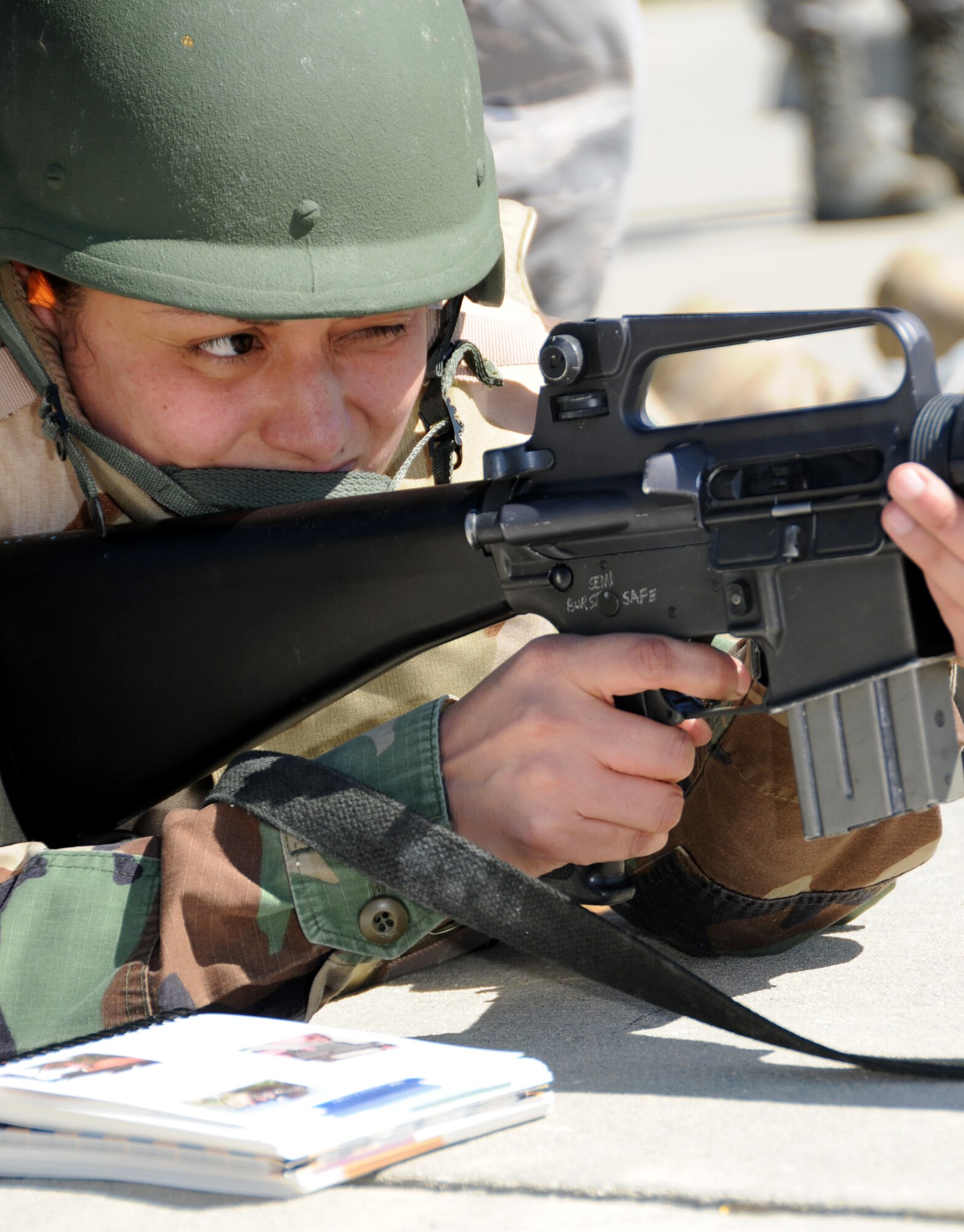 Staff Sgt. Patricia Rodriguez, 332nd Training Squadron, prepares to fire an M-16 during a weapons familiarization session Feb. 25 at the Combat Readiness Training Center in Gulfport.  Sergeant Rodriguez was one of the Keesler Airmen involved in last week‘s deployment exercise.  (U.S. Air Force photo by Kemberly Groue)