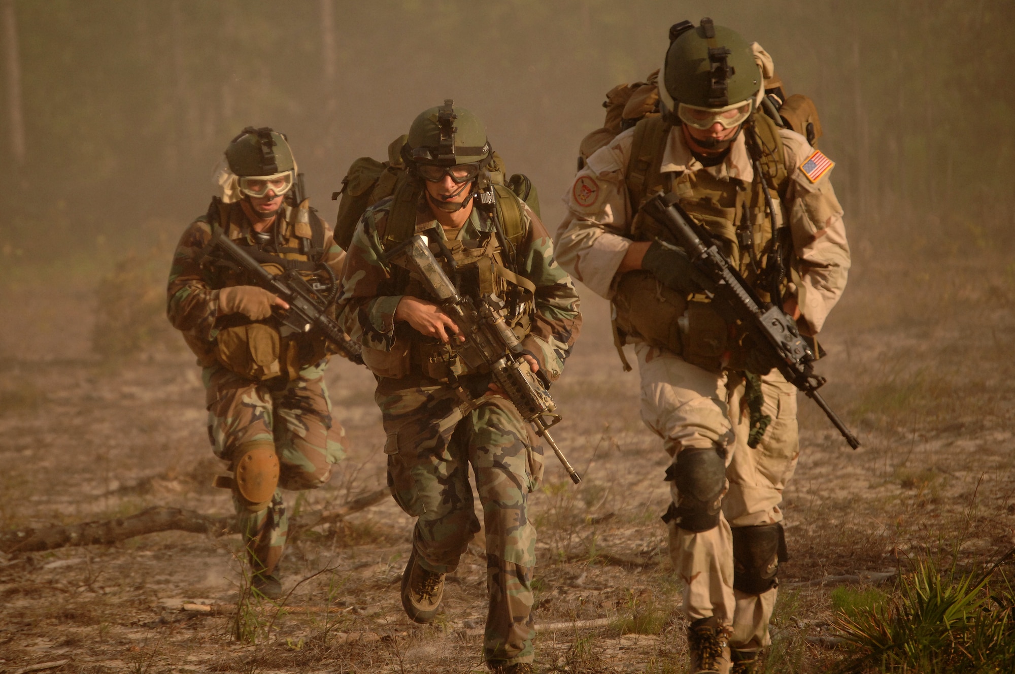 Combat control and pararescue trainees from the 720th Operations Support Squadron Advanced Skils Training flight at Hurlburt Field, Fla., run to their rally point after off-loading a helicopter Sept. 7, 2007. The special tactics Airmen were conducting a combat search and rescue training scenario on the Eglin Air Force Base range. AST is the last phase of training for combat controllers before they report to operations special tactics squadrons. (U.S. Air Force photo/Senior Airman Ali Flisek)