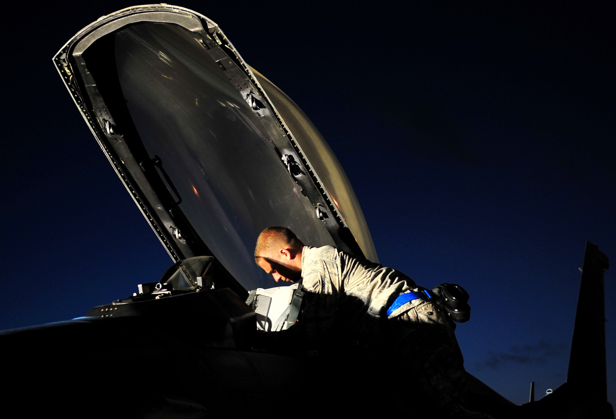 Airman 1st Class Justin Hodge sets up an F-16 Fighting Falcon before he conducts walk around launch procedures with the pilot Feb. 25, 2010, at Kadena Air Base, Japan. The aircraft is from the 18th Aggressor Squadron at Eielson Air Force Base, Alaska, and was participating in joint bilateral training with other U.S. forces and the Japan Air Self Defense Force from Feb. 22 to 26.  Airman Hodge is from the 354th Aircraft Maintenance Squadron at Eielson AFB.  (U.S. Air Force photo/Tech. Sgt. Rey Ramon)