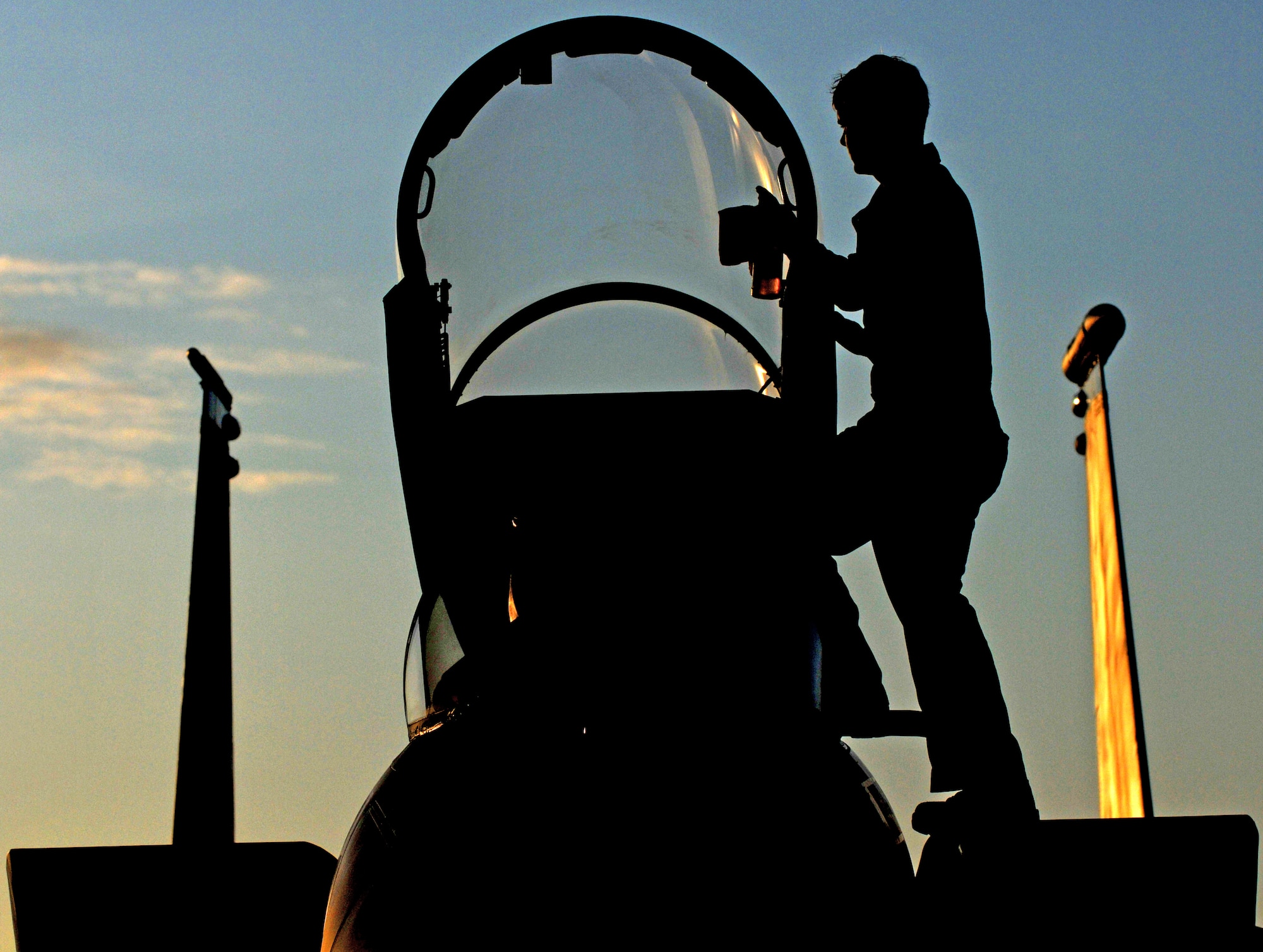Airman 1st Class Derek Wiltse cleans an F-15C Eagle canopy Feb. 23, 2010, at Kadena Air Base, Japan.  Kadena Airmen were participating in joint bilateral training with other U.S. forces and the Japan Air Self Defense Force from Feb. 22 to 26.  Airman Wiltse is assigned to the 44th Aircraft Maintenance Unit. (U.S. Air Force photo/Tech. Sgt. Rey Ramon)