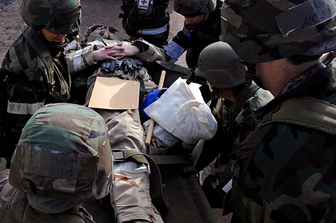 ELLSWORTH AIR FORCE BASE, S.D. -- Airmen from the 28th Medical Group prepare a patient for a simulated aero medical evacuation during a Phase II Operational Readiness Exercise, March 3. The Phase II ORE tested the ability of Airmen to operate in a deployed environment. (U.S. Air Force photo/Airman 1st Class Matthew Flynn)