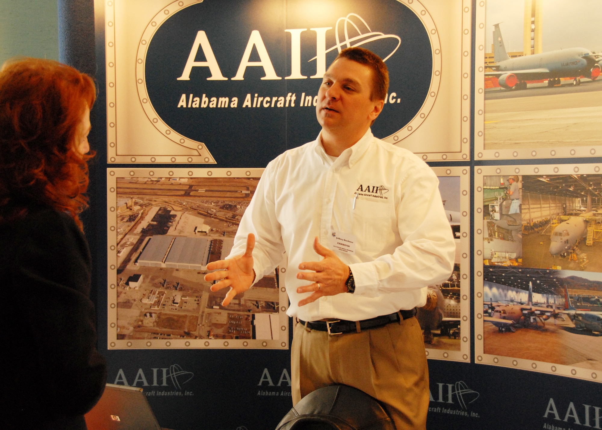 Jeffrey Buckner, Alabama Aircraft Industries Inc., talks to a potential client at the Small Business open house March 3 at Eglin Air Force Base, Fla.  Approximately 45 vendors turned out to exhibit their products and capabilities to government purchasers.  (U.S. Air Force photo/Samuel King Jr.)