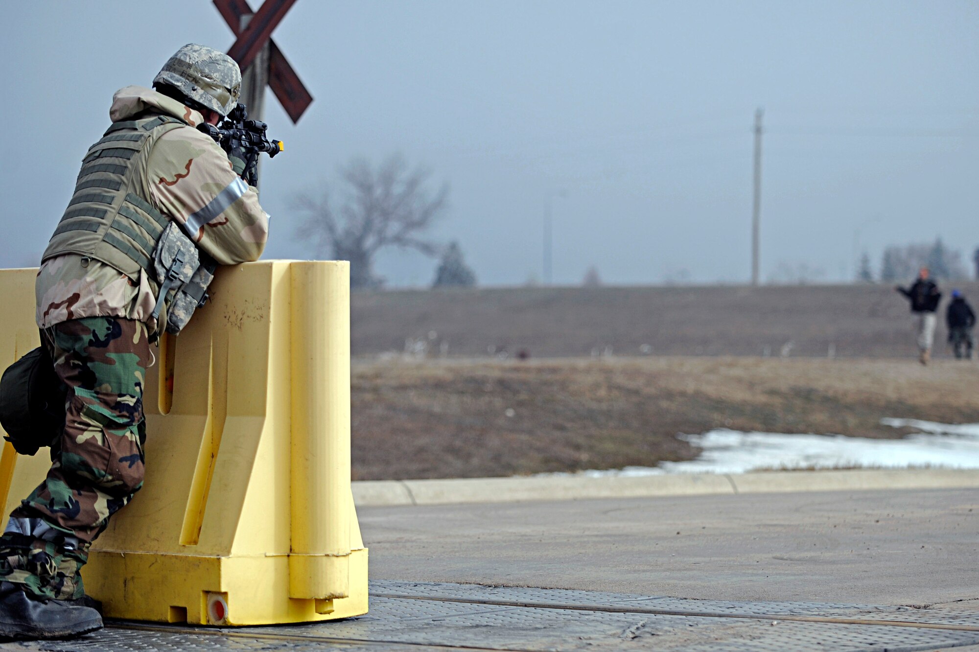 ELLSWORTH AIR FORCE BASE, S.D. -- Staff Sgt. Ben Pieta, 28th Security Forces Squadron patrolman, attempts to halt a suspicious person walking towards an entry control point during a Phase II Operational Readiness Exercise, March 3. The Phase II ORE tested Airmen's operational readiness in a deployed environment. (U.S. Air Force photo/Airman 1st Class Matthew Flynn)