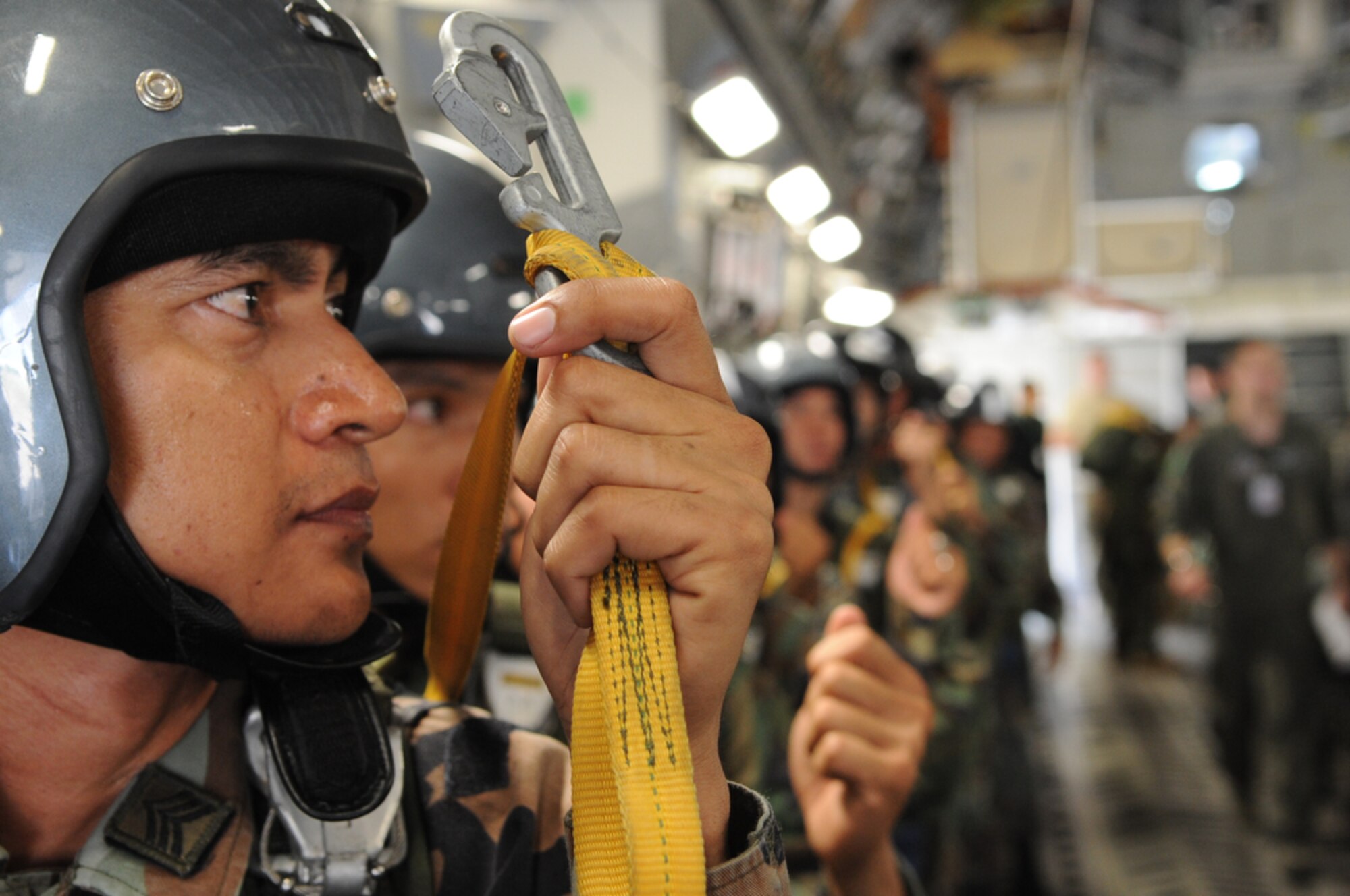A member of the Royal Thai Air Force Parachute Team gets ready for his 10,000-foot static-line jump from a C-17 Globemaster III during Cope Tiger 2010 at Dom Muang Royal Thai Air Force Base, Thailand, March 3. Cope Tiger is a multilateral, combined and joint command post and field training exercise involving the United States, Thailand and Singapore. The exercise takes place March 1-12. (U.S. Air Force photo/Tech. Sgt. Cohen A. Young)