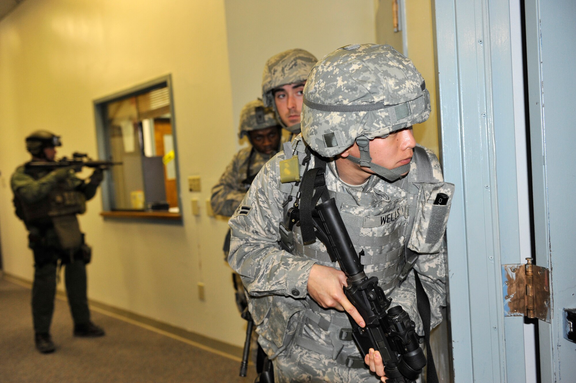 Airman 1st Class Tyler Wells, a 19th Security Forces Squadron patrolman, prepares to clear a room Feb. 26 during an active shooter scenario on base. Security forces Airmen conducted joint training with FBI agents during a training scenario while practicing real-world tactics. (U.S. Air Force photo by Christine Clark)