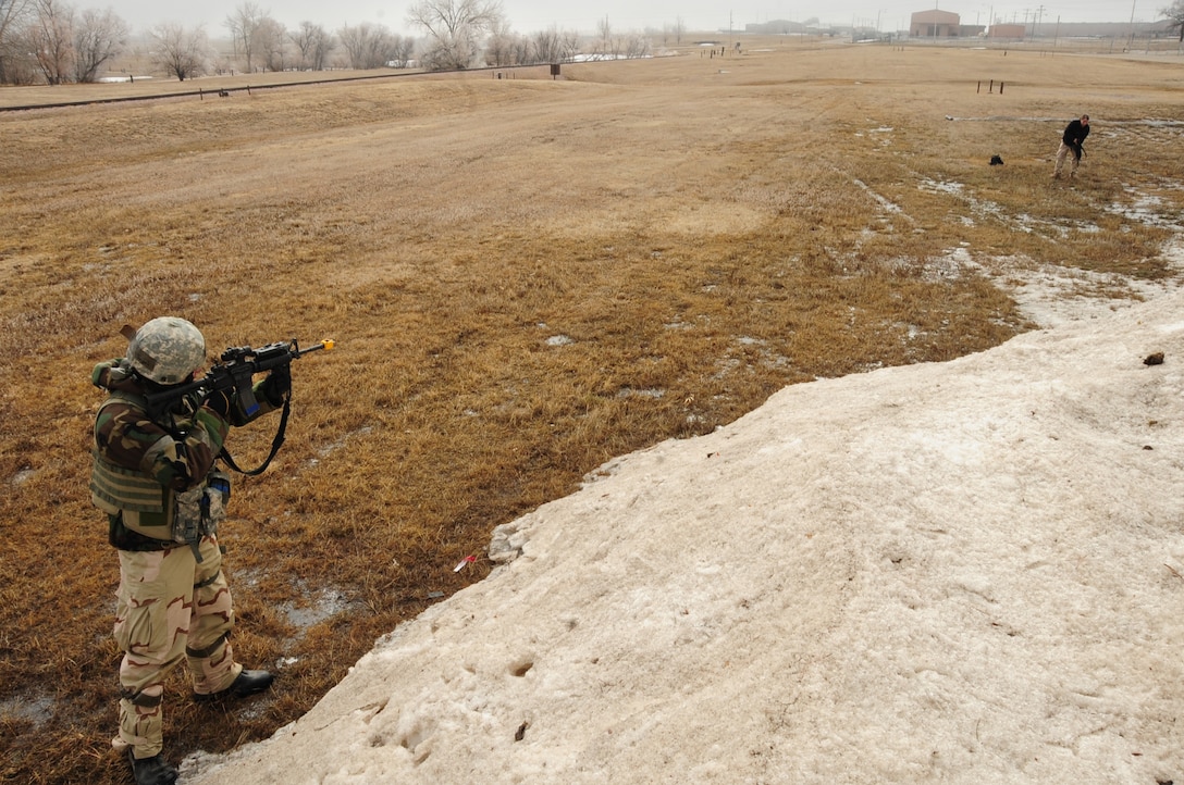 ELLSWORTH AIR FORCE BASE, S.D. -- Staff Sgt. Joseph Vawter, 28th Security Forces Squadron patrolman, fires at a simulated terrorist attempting to breach the base perimeter during a Phase II Operational Readiness Exercise, March 2.  The Phase II ORE is designed to mimic a deployed environment and test the combat abilities of Ellsworth's Airmen. (U.S. Air Force photo/Airman 1st Class Anthony Sanchelli)

