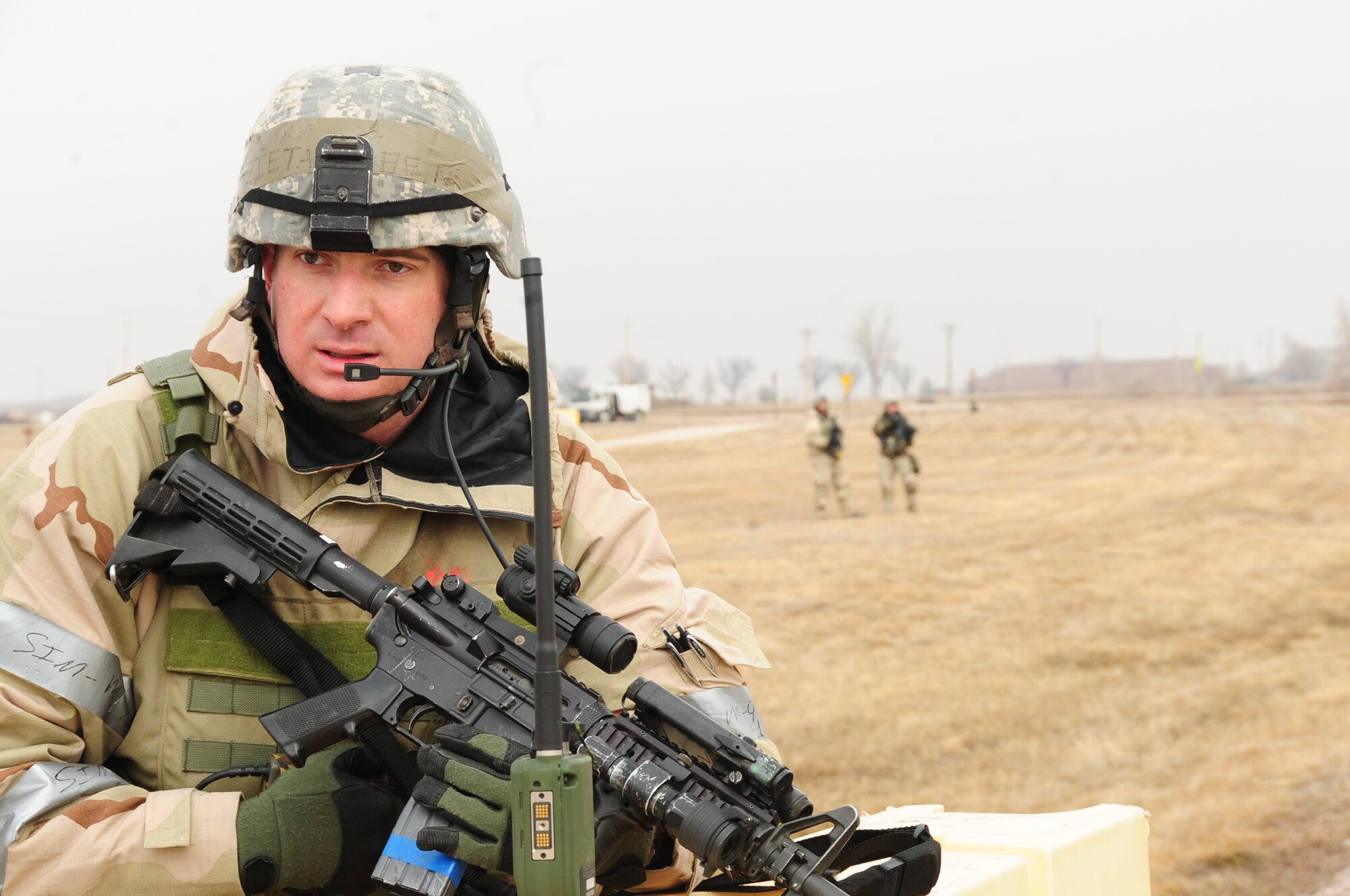 ELLSWORTH AIR FORCE BASE, S.D. -- Staff Sgt. Ben Pieta, 28th Security Forces Squadron patrolman, talks with his team after a simulated suicide bomber attempted to breach the base perimeter during a Phase II Operational Readiness Exercise, March 2.  The Phase II ORE is designed to mimic a deployed environment and test the combat abilities of Ellsworth's Airmen. (U.S. Air Force photo/Airman 1st Class Anthony Sanchelli)
