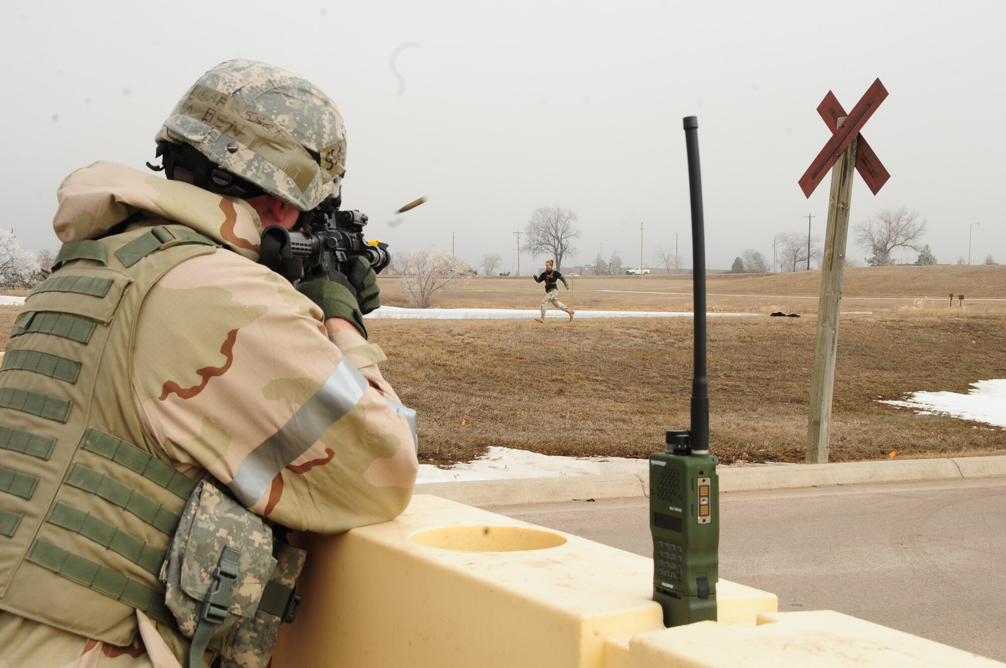 ELLSWORTH AIR FORCE BASE, S.D. -- Staff Sgt. Ben Pieta, 28th Security Forces Squadron patrolman, fires blanks at a simulated suicide bomber attempting to breach the base perimeter during a Phase II Operational Readiness Exercise, March 2.  The Phase II ORE is designed to mimic a deployed environment and test the combat abilities of Ellsworth's Airmen. (U.S. Air Force photo/Airman 1st Class Anthony Sanchelli)

