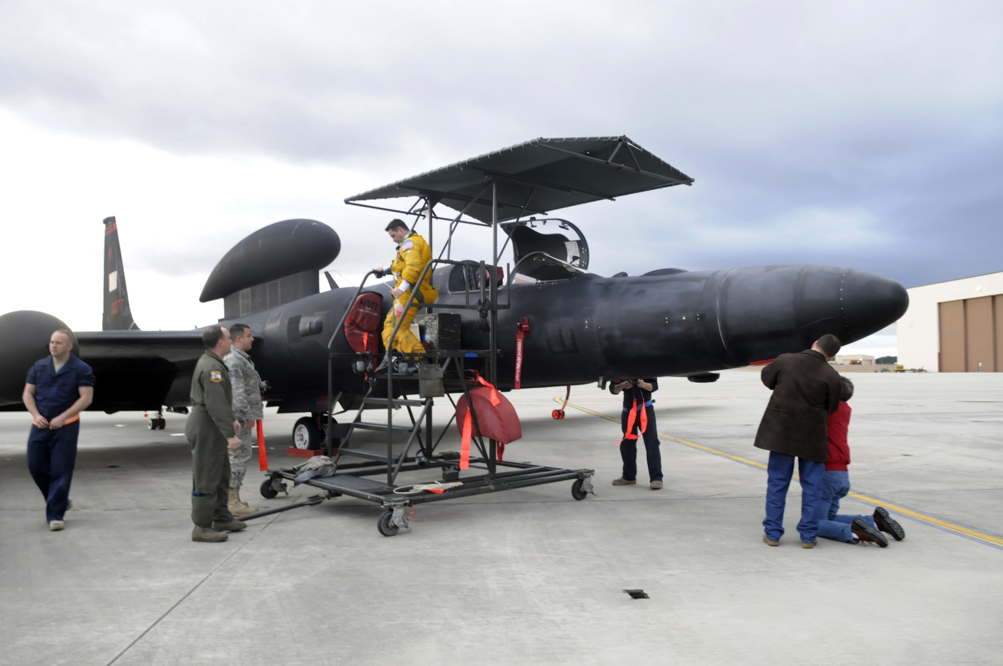 Major David Tifford, U-2 pilot, steps out of the aircraft Feb. 22 after flying a mission over Haiti. U. S. Air Force photo by Sue Sapp