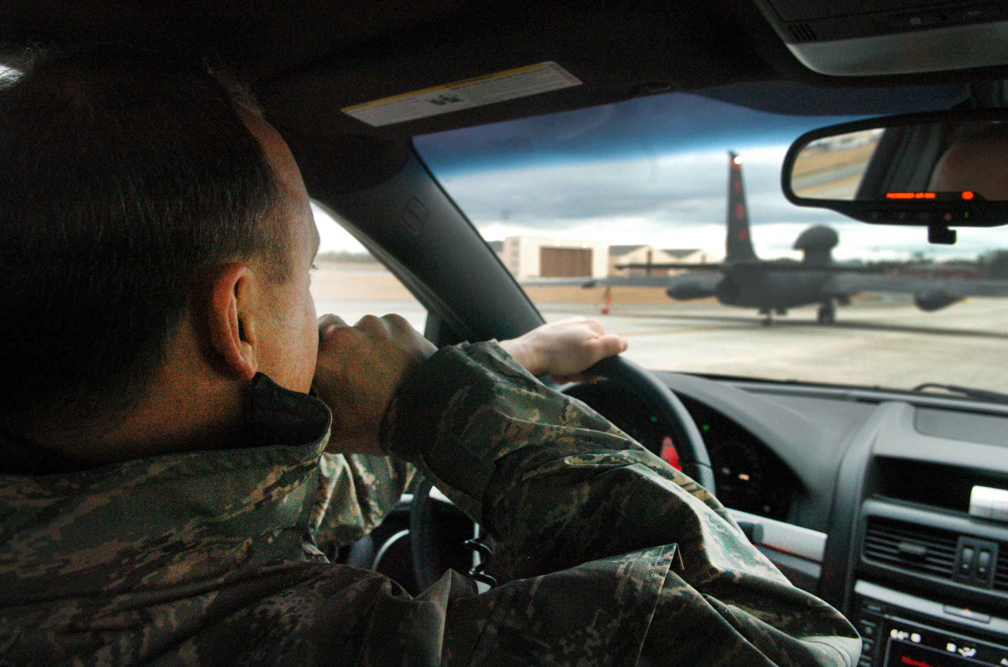 Major Rich Mehl, U-2 pilot, drives the chase car and follows the U-2 as it taxies onto Robins flightline. U. S. Air Force photo by Sue Sapp