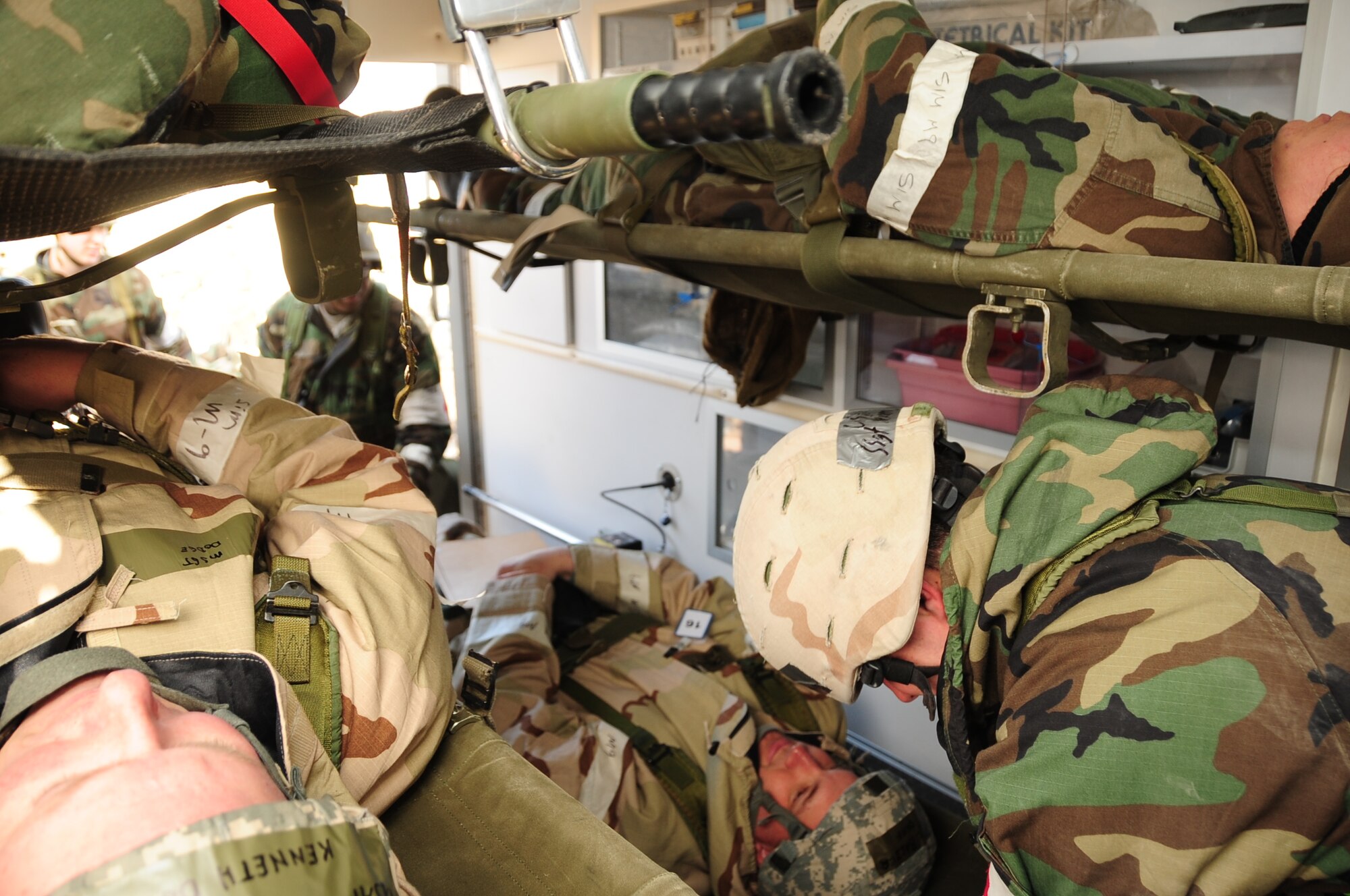 ELLSWORTH AIR FORCE BASE, S.D. -- Airmen from the 28th Medical Group load simulated casualties into an ambulance for evacuation during a Phase II Operational Readiness Exercise, March 2.  The Phase II ORE is designed to mimic a deployed environment and test the combat abilities of Ellsworth's Airmen. (U.S. Air Force photo/Airman 1st Class Anthony Sanchelli)
