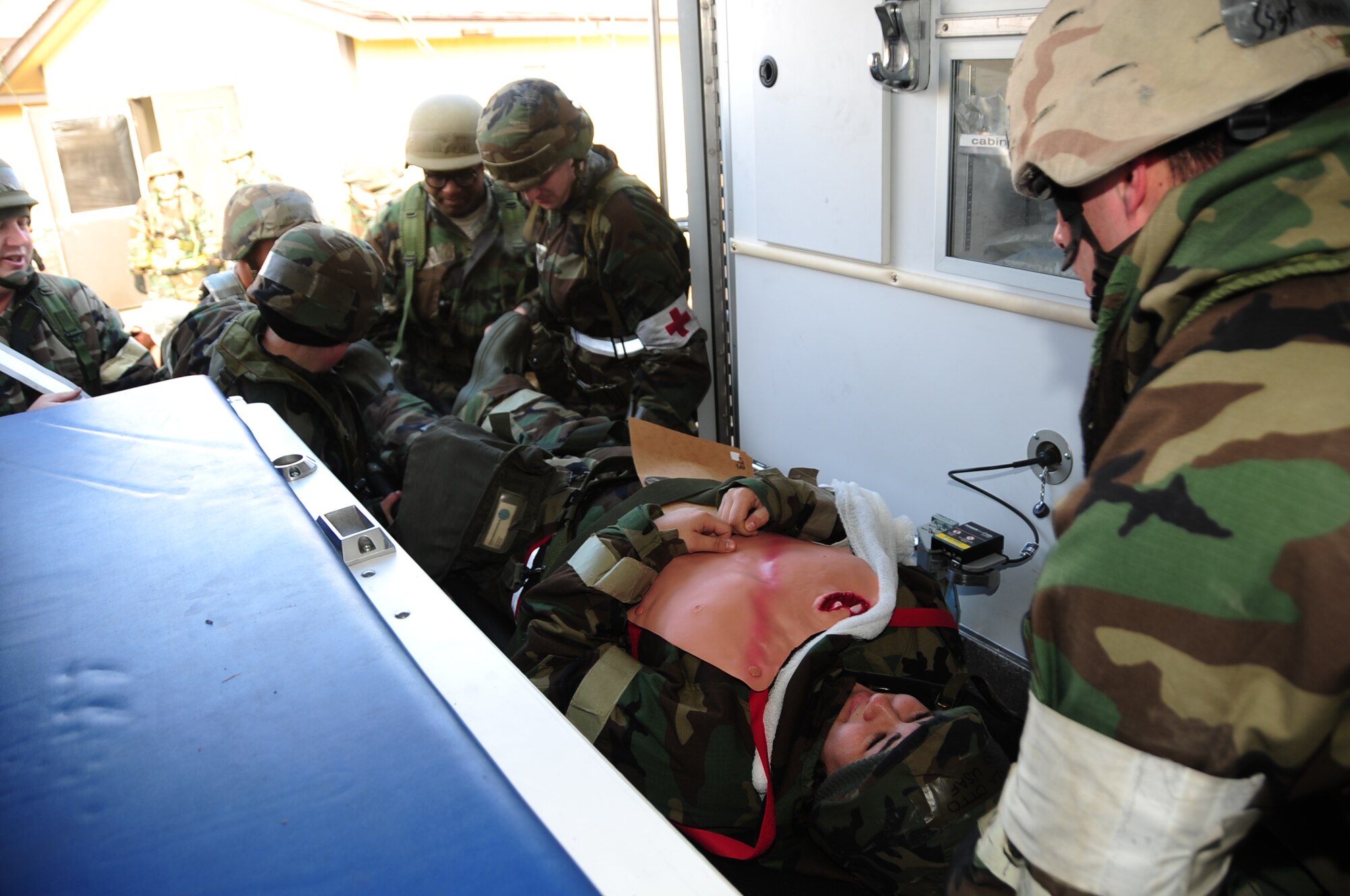 ELLSWORTH AIR FORCE BASE, S.D. -- Airmen from the 28th Medical Group load simulated casualties into an ambulance for evacuation during a Phase II Operational Readiness Exercise, March 2.  The Phase II ORE is designed to mimic a deployed environment and test the combat abilities of Ellsworth's Airmen. (U.S. Air Force photo/Airman 1st Class Anthony Sanchelli)
