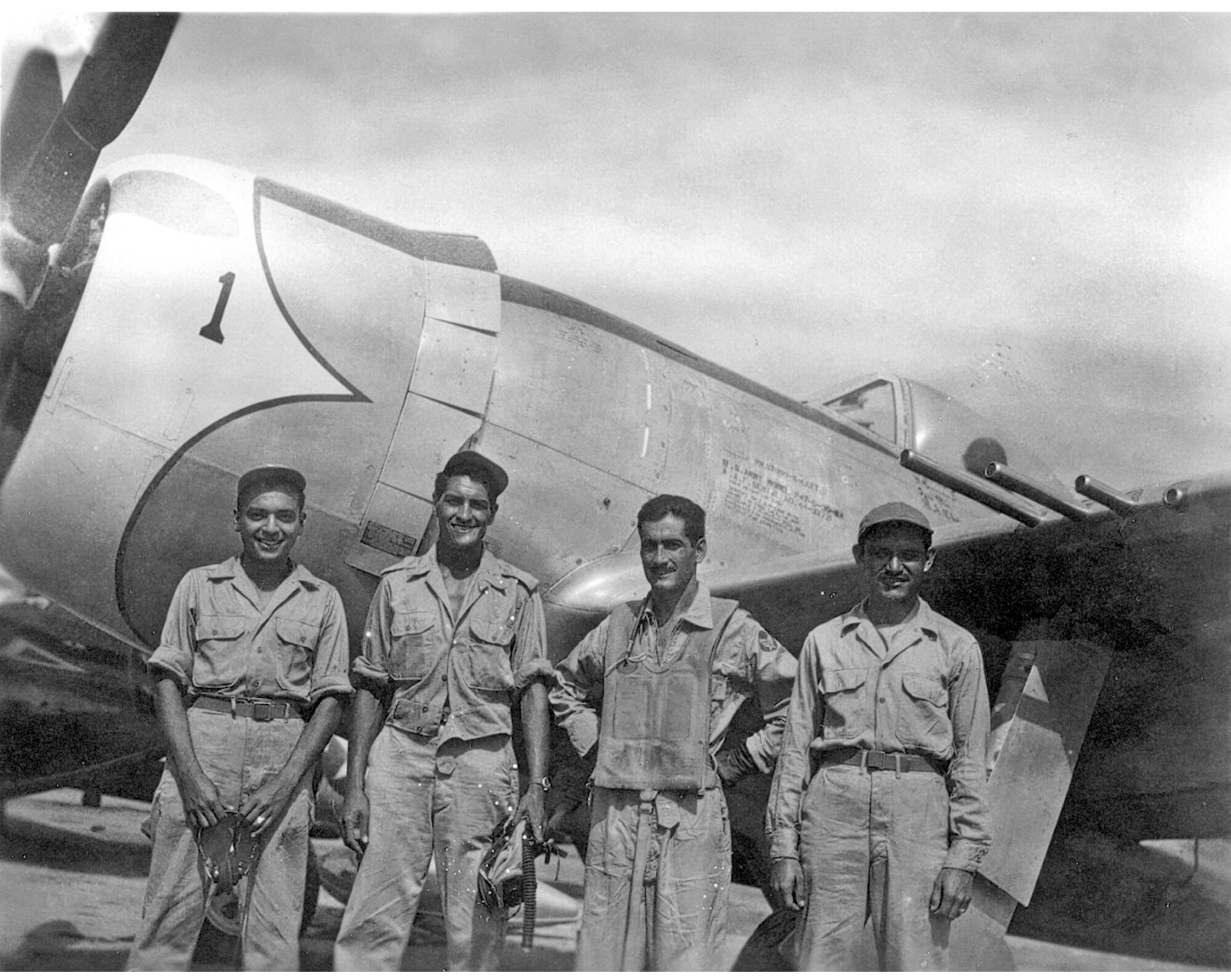 Mexican air force Capt. Radames Gaxiola Andrade stands in front of his P-47D with his maintenance team after he returned from a combat mission.  Captain Andrade was assigned to the Mexican air force's Escuadron 201. Members of the Escuadron 201 fought alongside U.S. forces during World War II. (Courtesy photo)